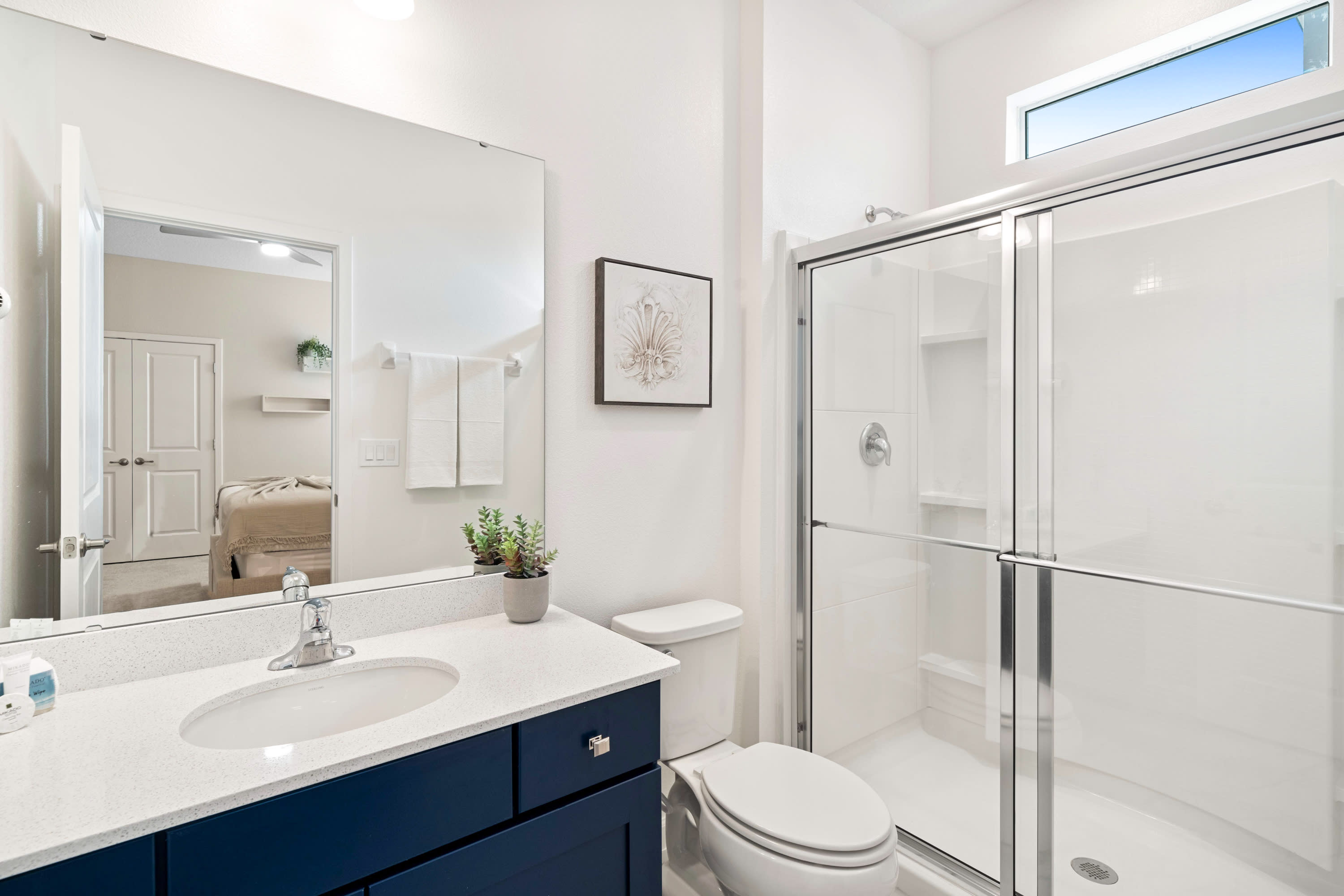 Bright Bathroom With A Clean Design And Elegant Vanity
