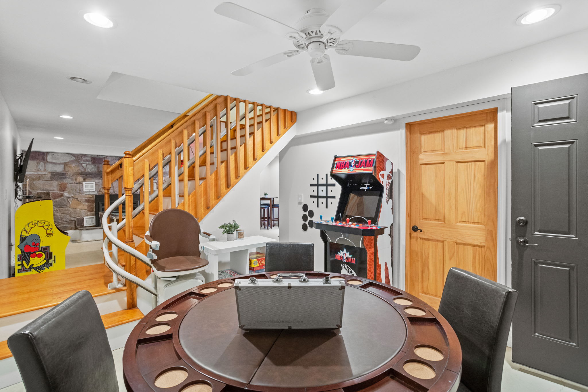 A vibrant game room featuring a poker table, arcade games, and board games, designed for laughter-filled game nights with family and friends.

Chair Lift - not operational