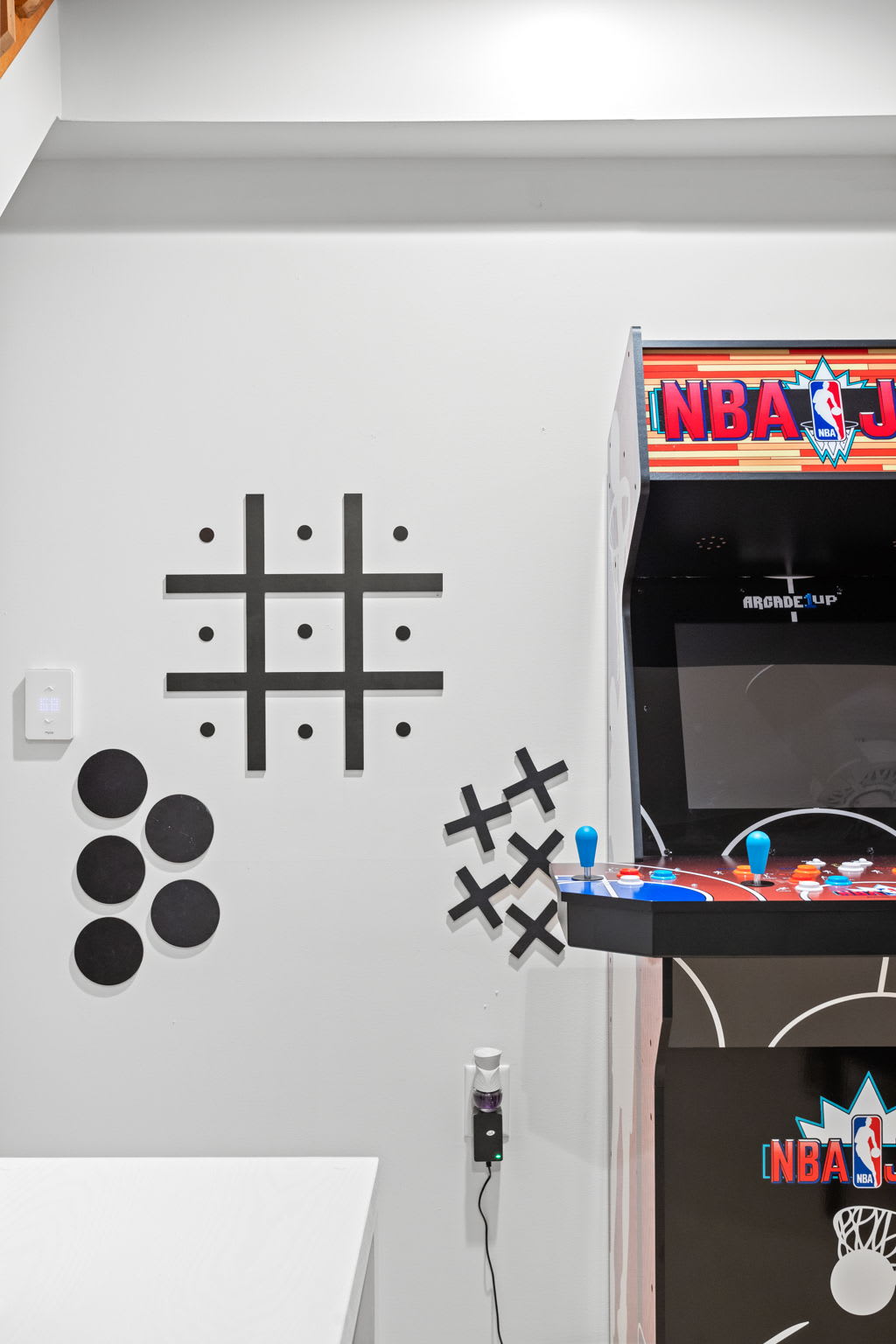 Tic-tac-toe meets modern décor in this creative game nook, adding an extra touch of fun to the space.