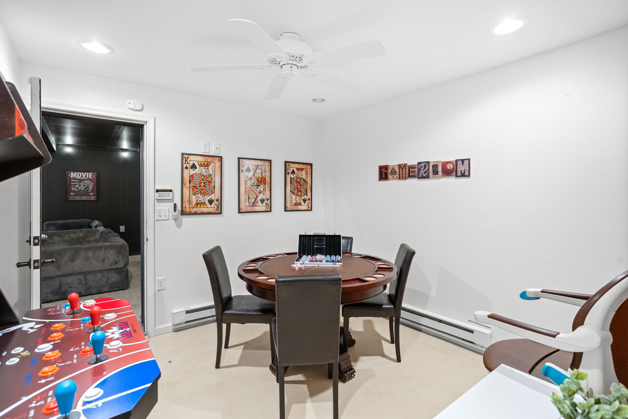 A stylish round poker table set against a backdrop of vibrant artwork, perfect for game nights and friendly competition.