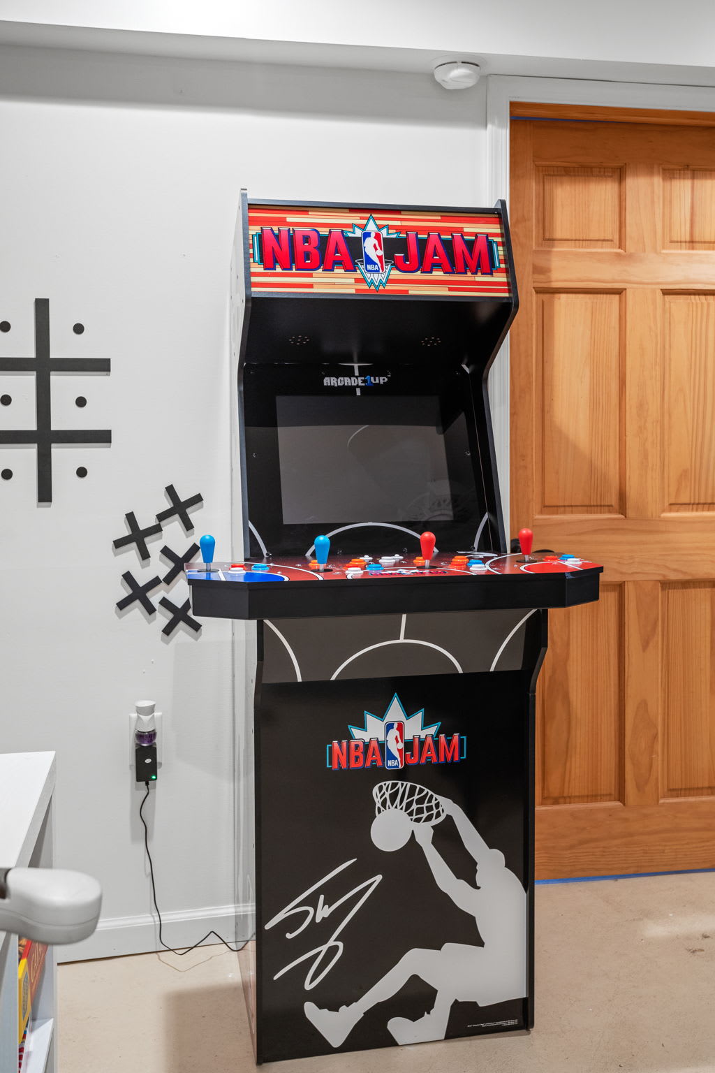 A retro-style arcade machine adds a classic touch, inviting you to relive old-school gaming adventures.
