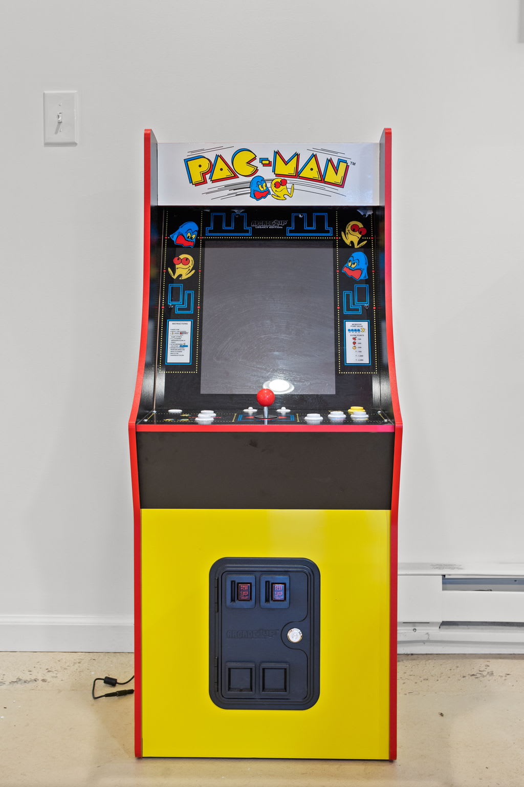 A vibrant arcade machine brings a pop of color and a dose of nostalgia to this game lover’s retreat.