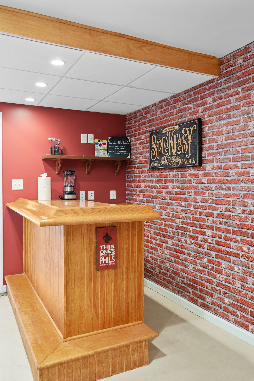 Designed for entertaining, this speakeasy-style nook offers a blend of vintage aesthetics and modern convenience.