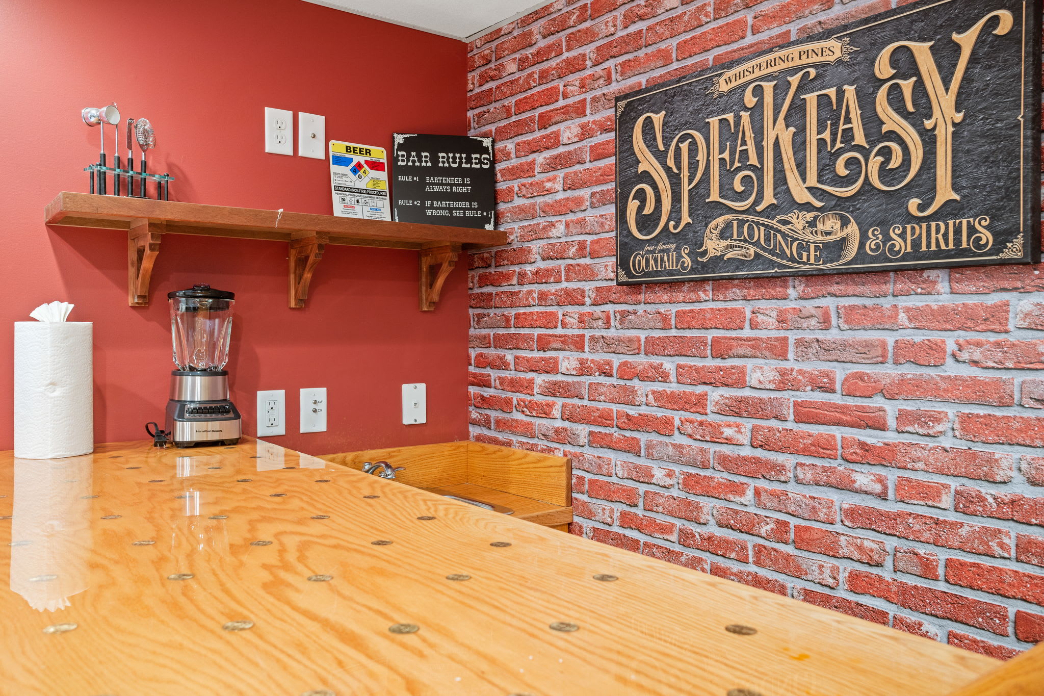 A cozy bar area featuring warm wood tones, brick accents, and all the essentials for crafting the perfect drink or morning coffee.