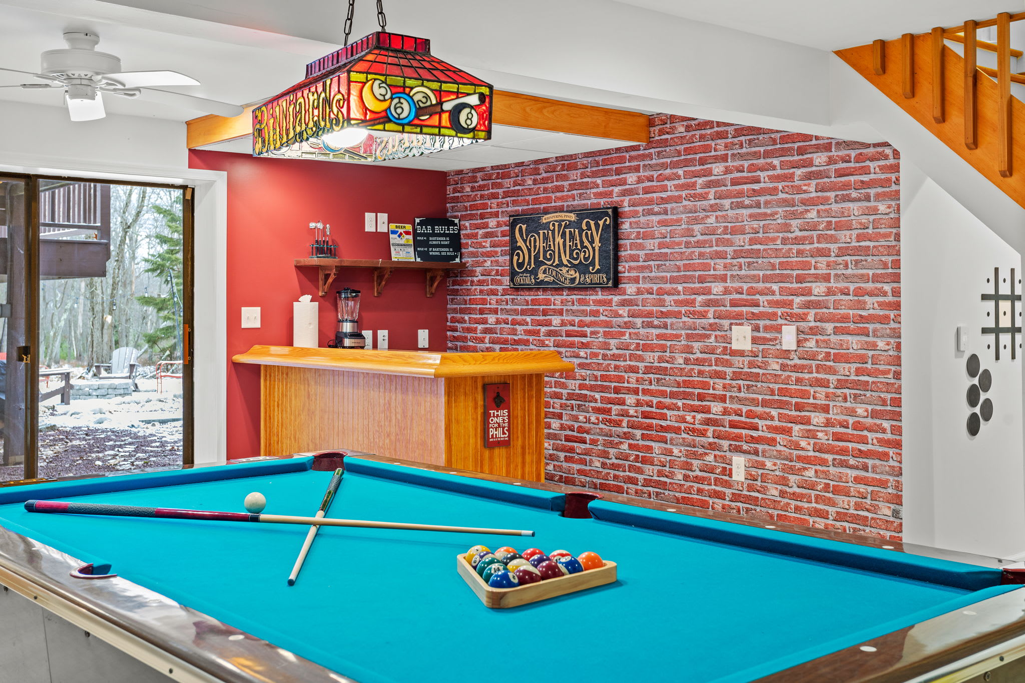 The perfect blend of a speakeasy-inspired bar and a pool table setup, ideal for lively nights with friends and family.