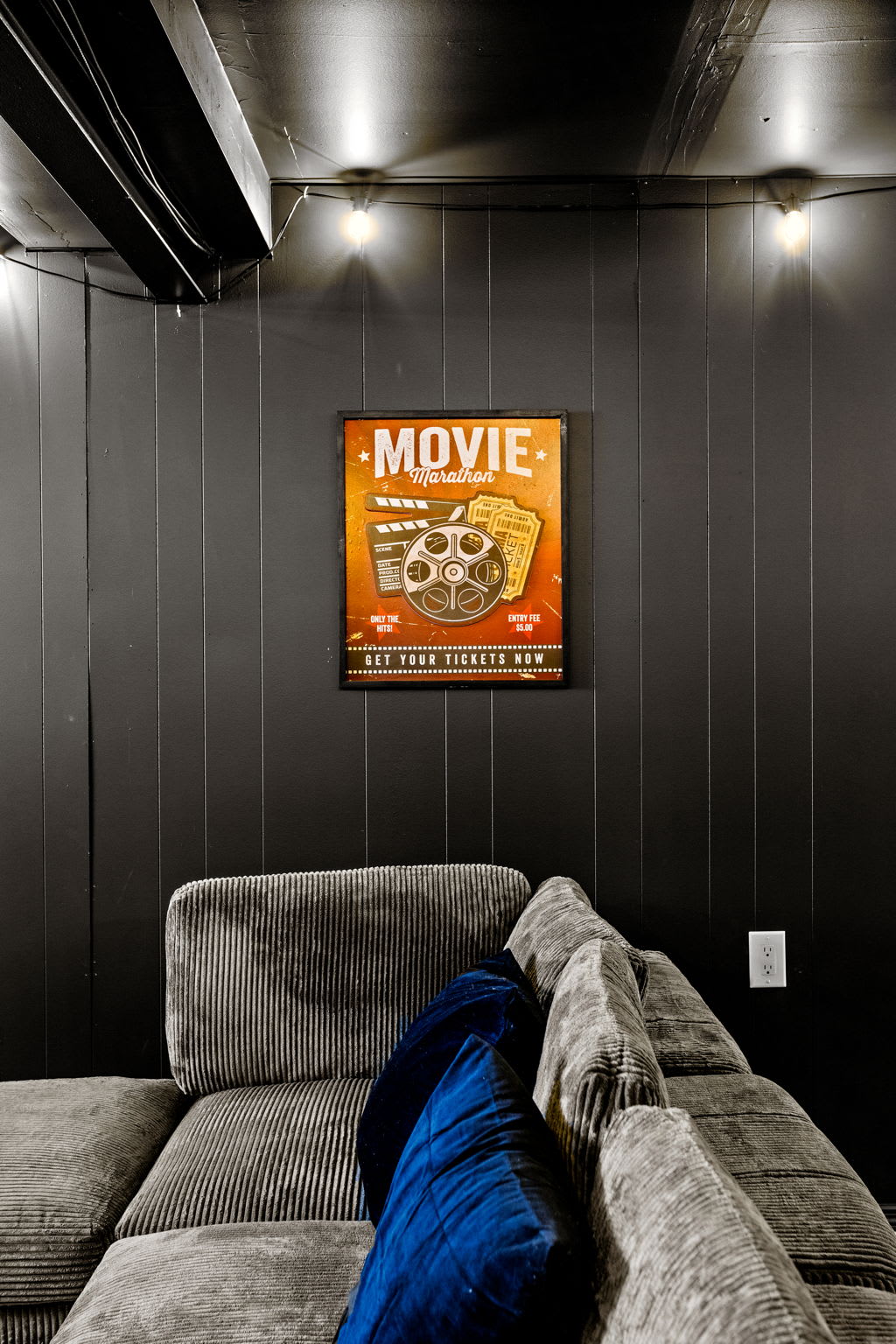 A fun “Movie Night” sign adds a nostalgic touch, making this home theater feel like a private cinema retreat.