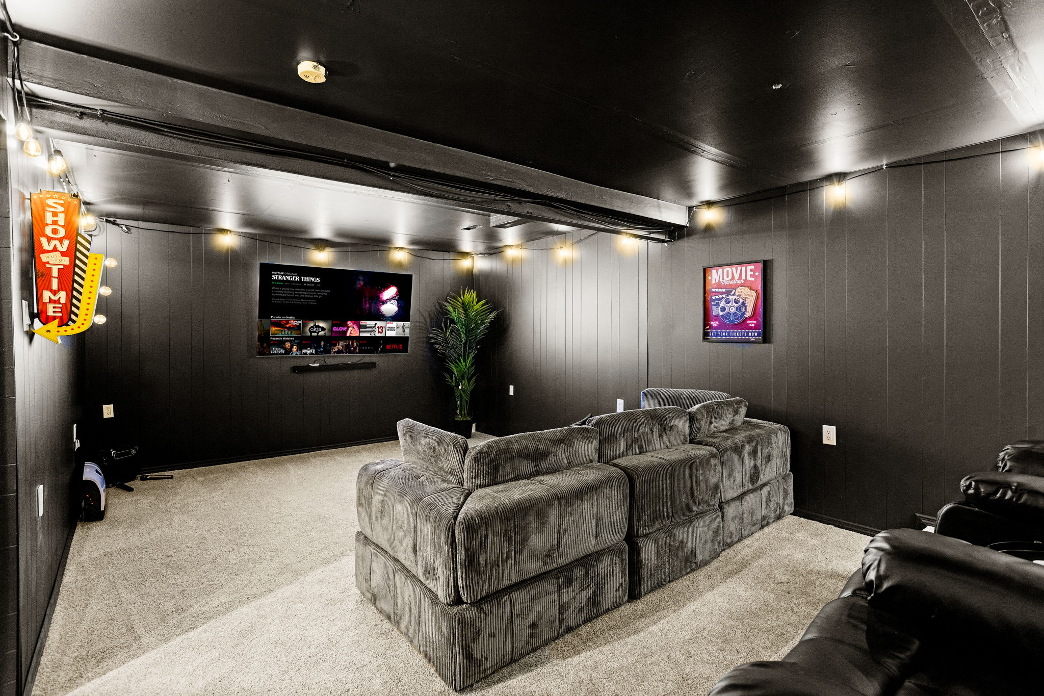 With a massive sectional, ambient lighting, and a large screen, this room is designed for both relaxation and high-energy movie nights.