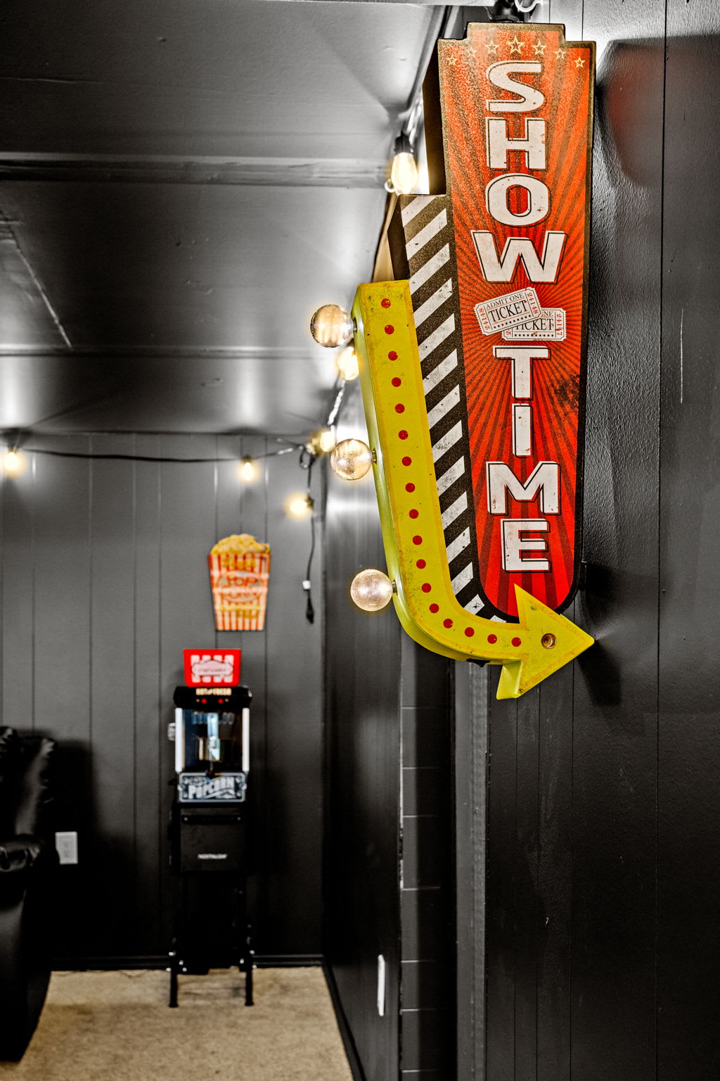 Step into a private cinema experience! With a bold “Showtime” sign and classic arcade vibes, this entertainment space is designed for unforgettable movie nights.