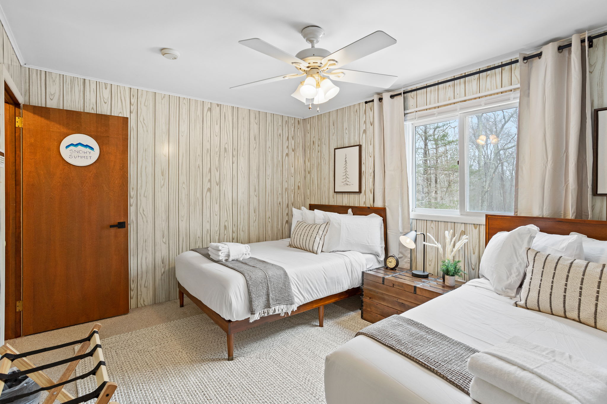 This beautifully designed space features 2 queen beds, neutral tones, and rustic decor, making it the perfect place to unwind after a long day. (2 Queen Size Bed)