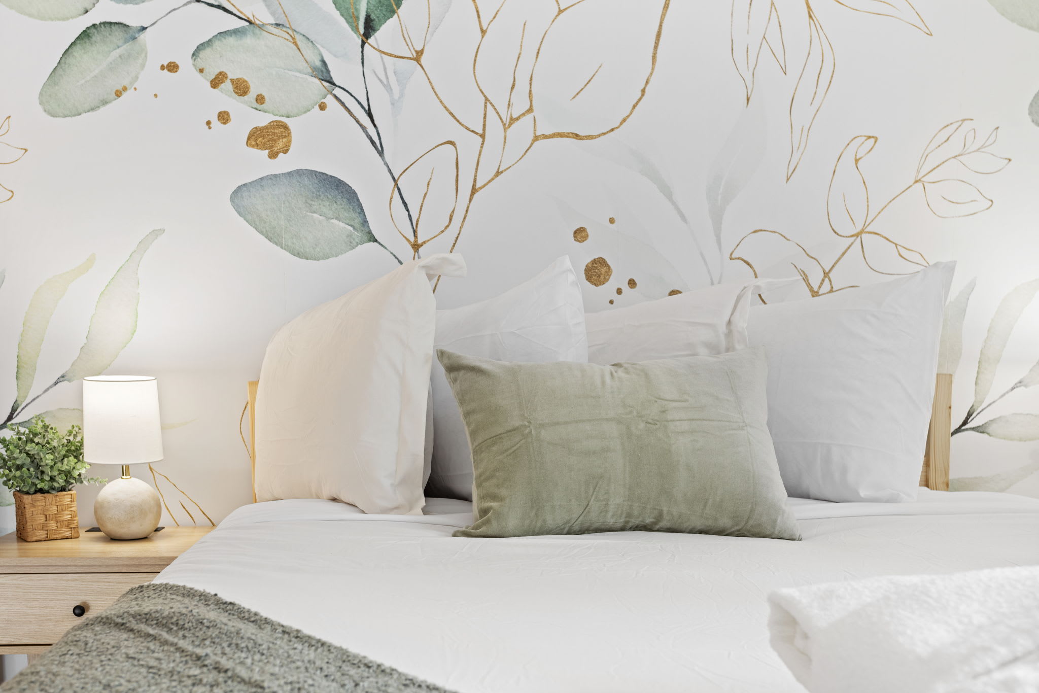 A cozy bedroom with dreamy floral wall art and a soft color palette, creating a soothing atmosphere. (1 Queen Size Bed)