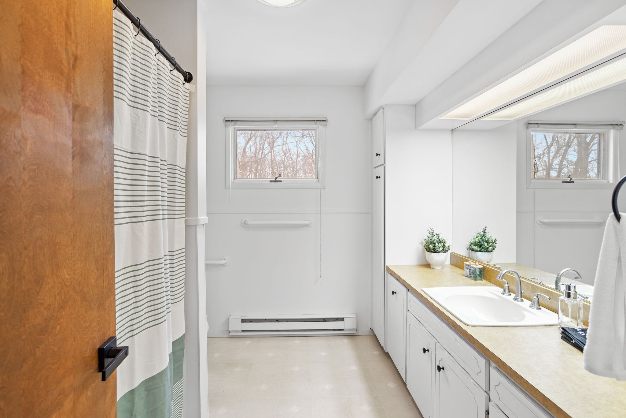 A fresh and functional bathroom setup, perfect for multiple guests to get ready with ease.