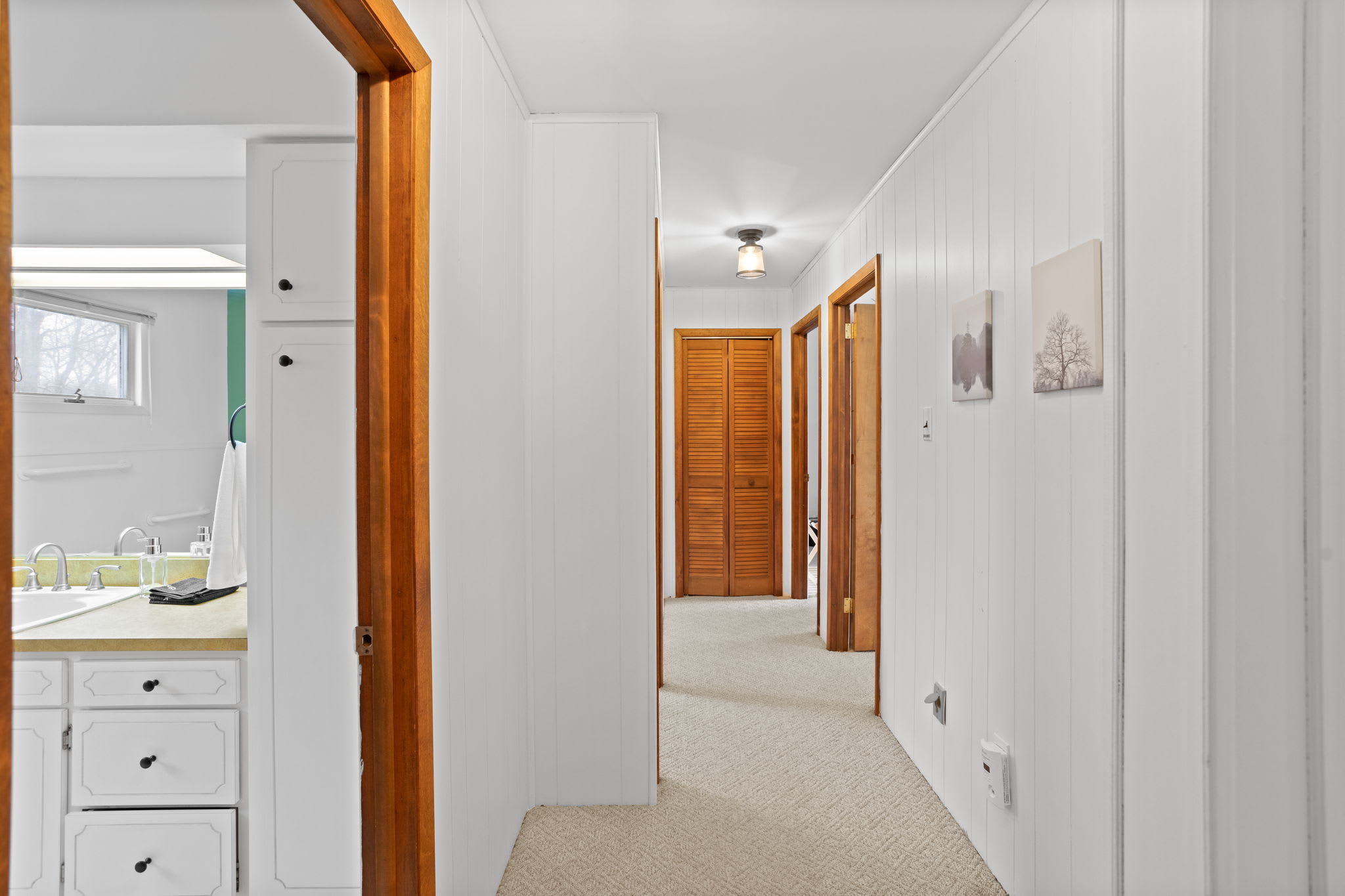 A seamless flow from one space to another, featuring warm wooden accents and soft natural light.