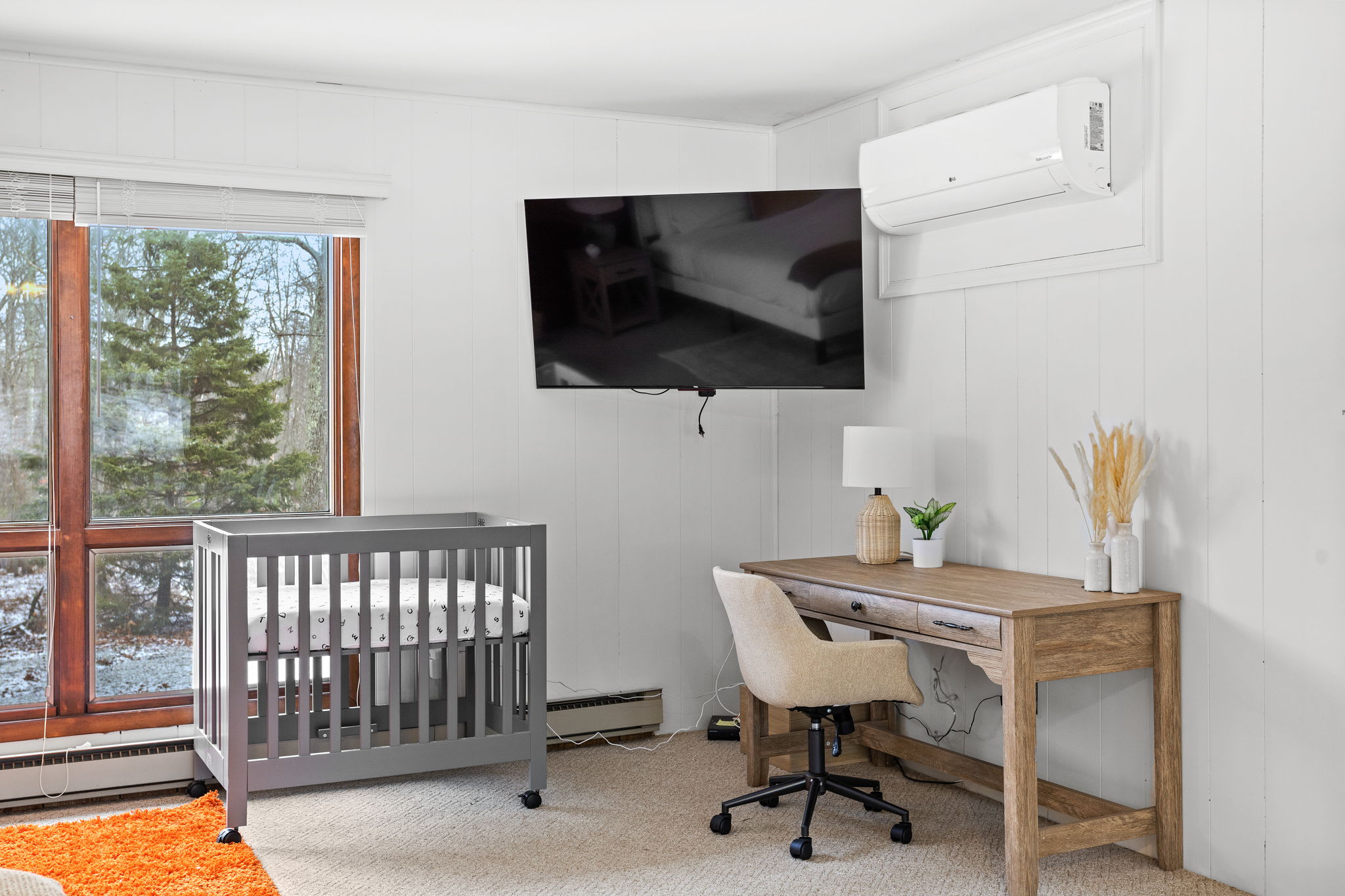 A well-designed workspace within the bedroom, perfect for catching up on emails or planning your adventures. Large windows offer plenty of natural light to keep you inspired.
