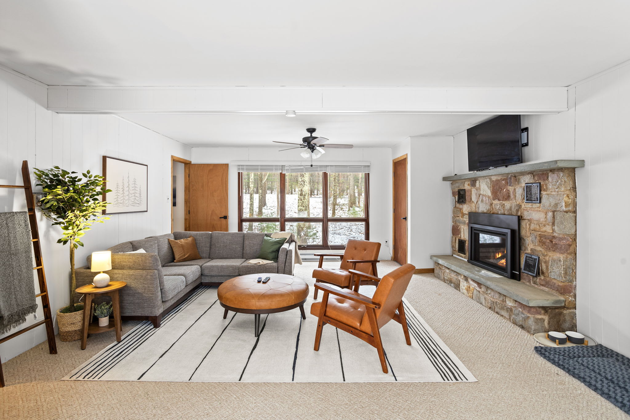 A thoughtfully designed living space with clean lines, cozy textures, and plenty of natural light.