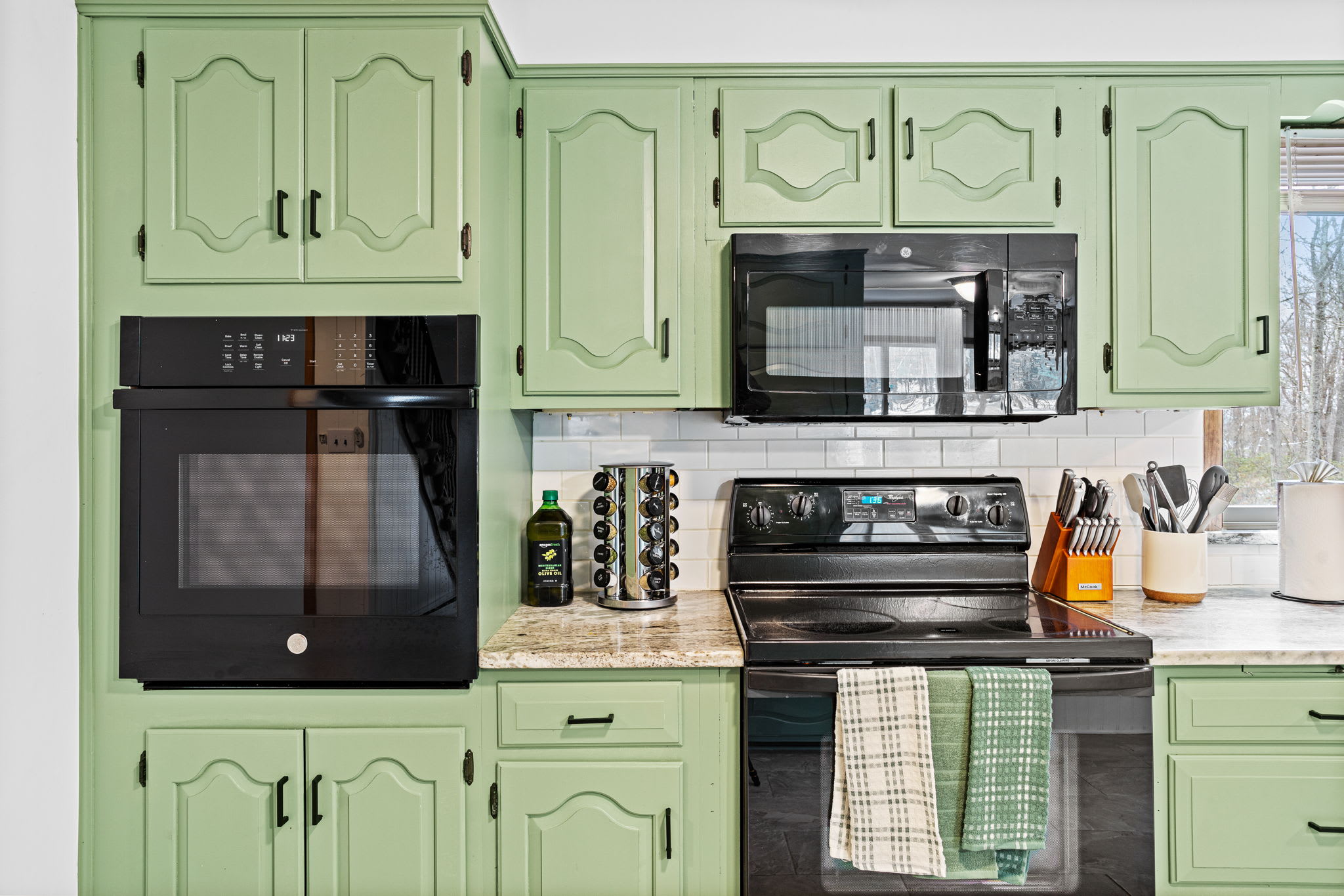 A perfect balance of classic cabinetry and contemporary appliances, making cooking both easy and enjoyable.