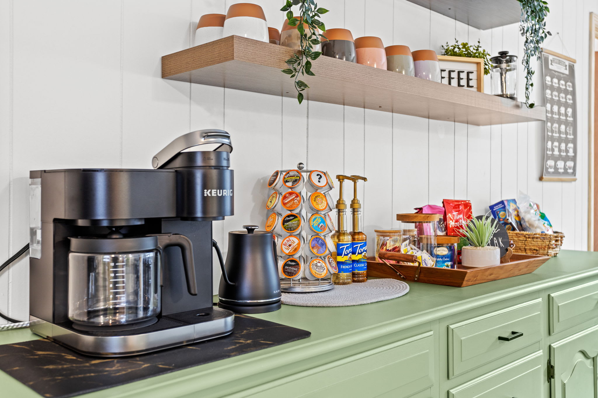 A well-stocked beverage station featuring multiple coffee options, perfect for fueling up before a day of adventure.