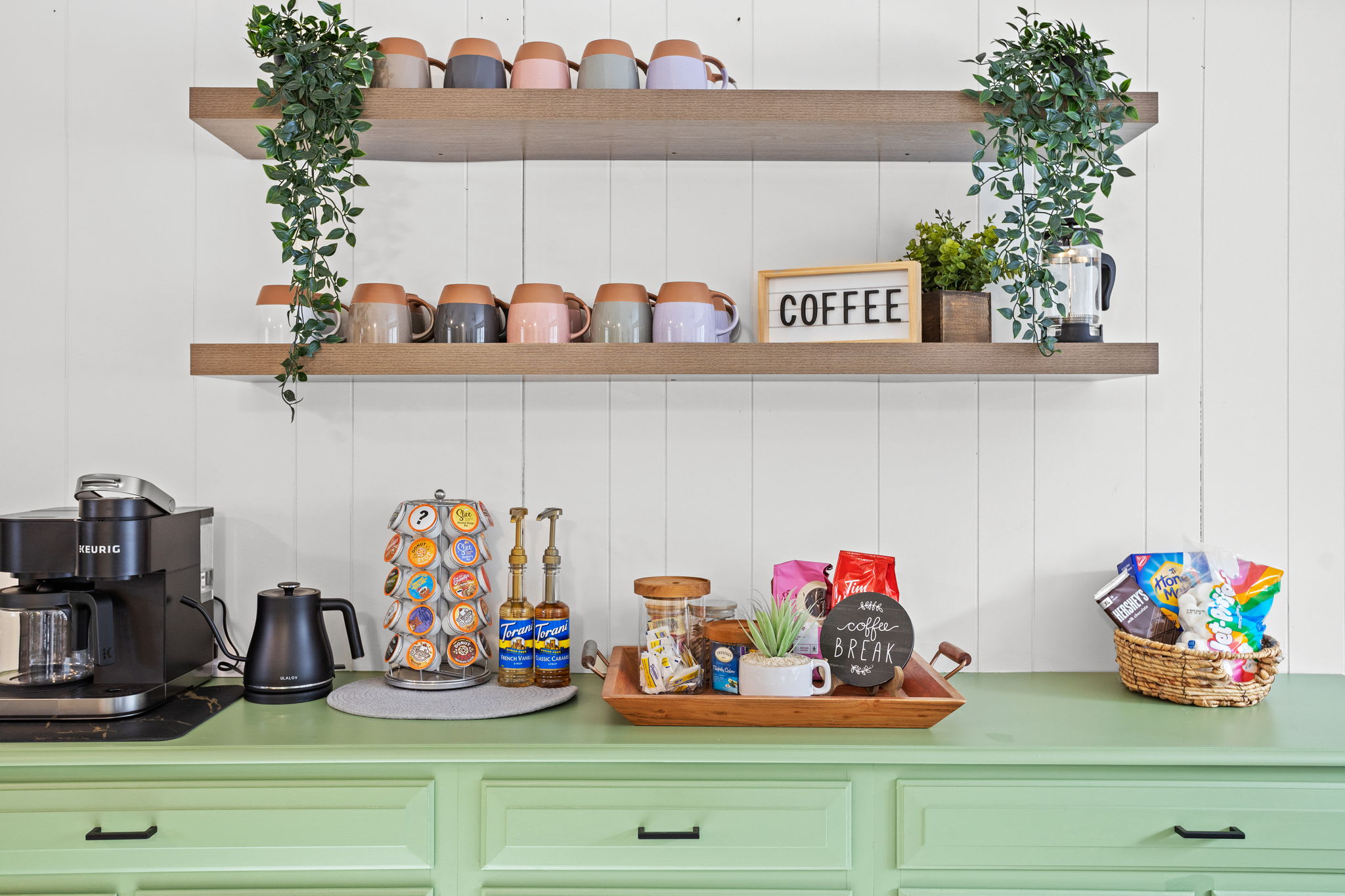 Start your mornings right with this delightful coffee station, complete with a variety of brews and cozy accents.