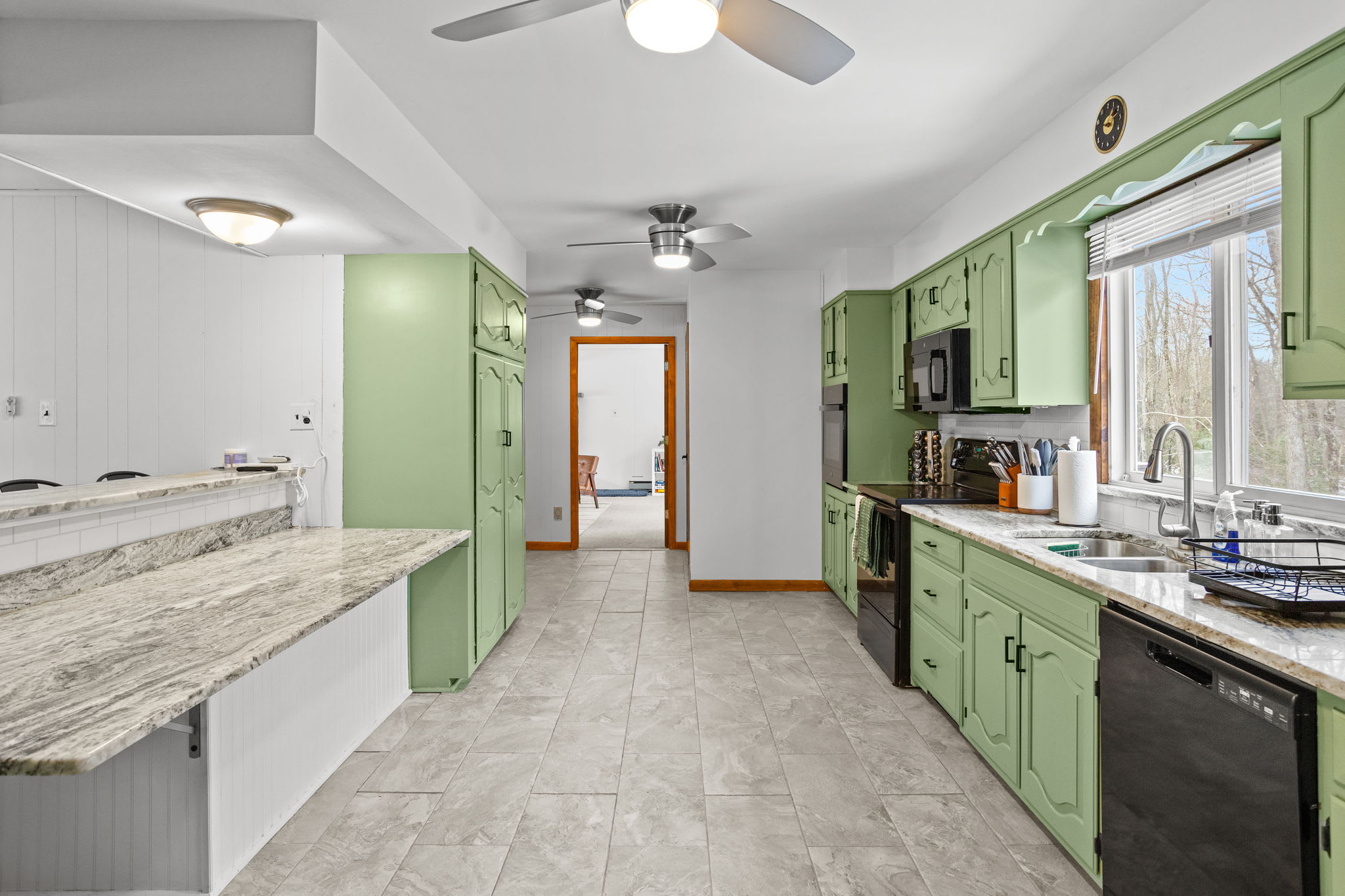 A well-designed kitchen with a sleek island, plenty of prep space, and a seamless flow into the dining area.