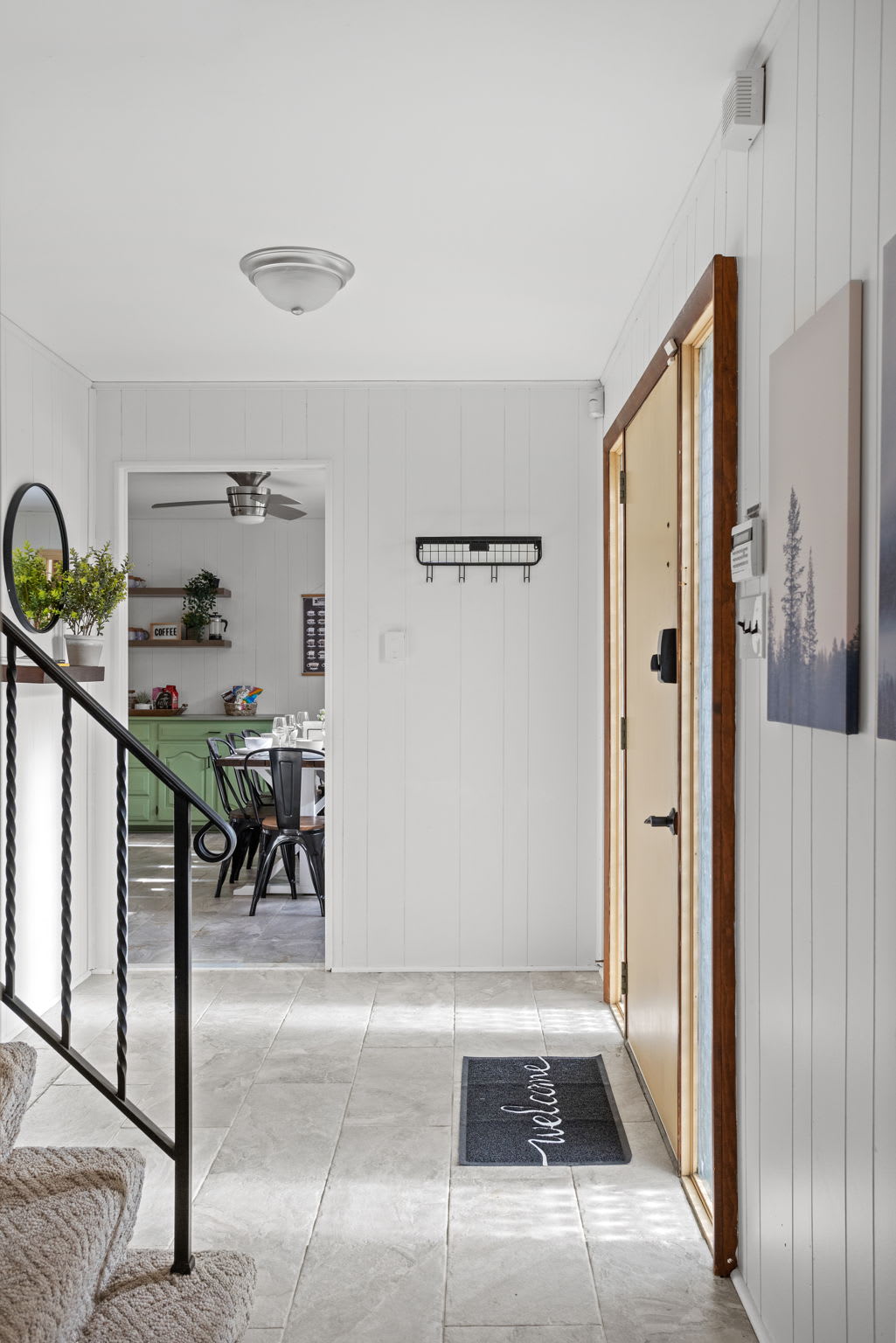 A stylish front entrance with modern farmhouse decor, creating a warm and inviting first impression.