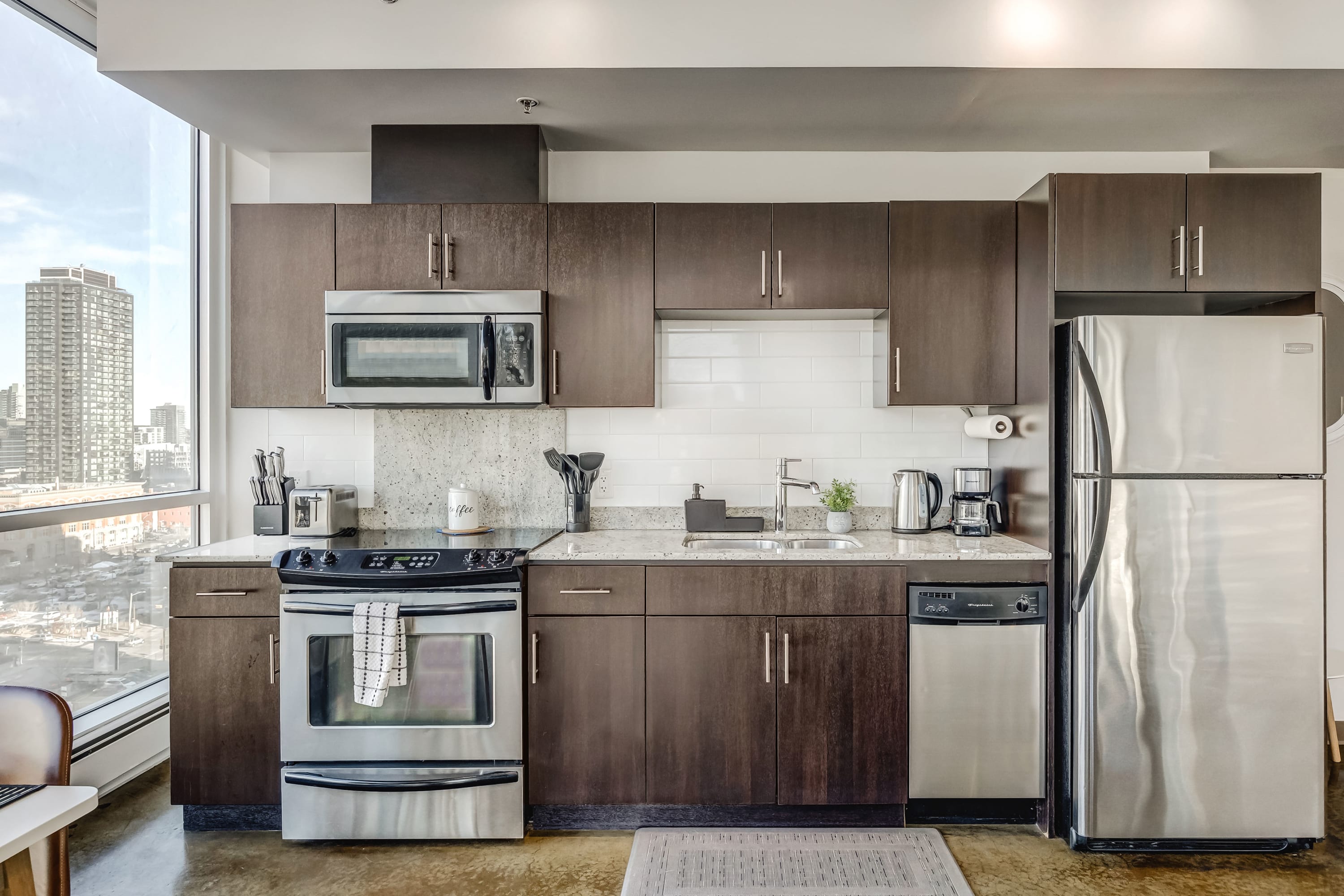 Fully equipped kitchen with silver appliances