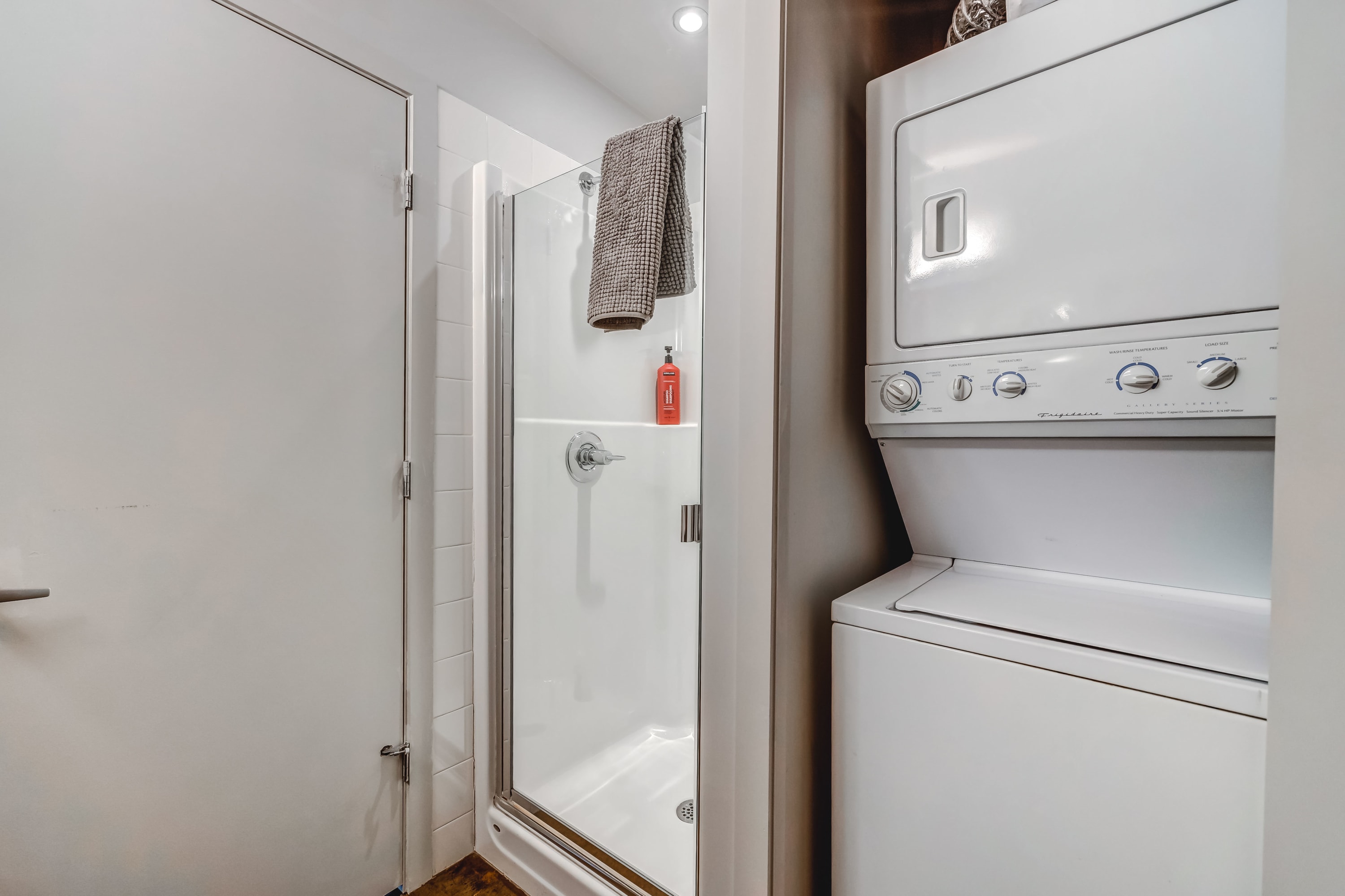Bathroom standing shower and laundry facilities (washer and dryer)
