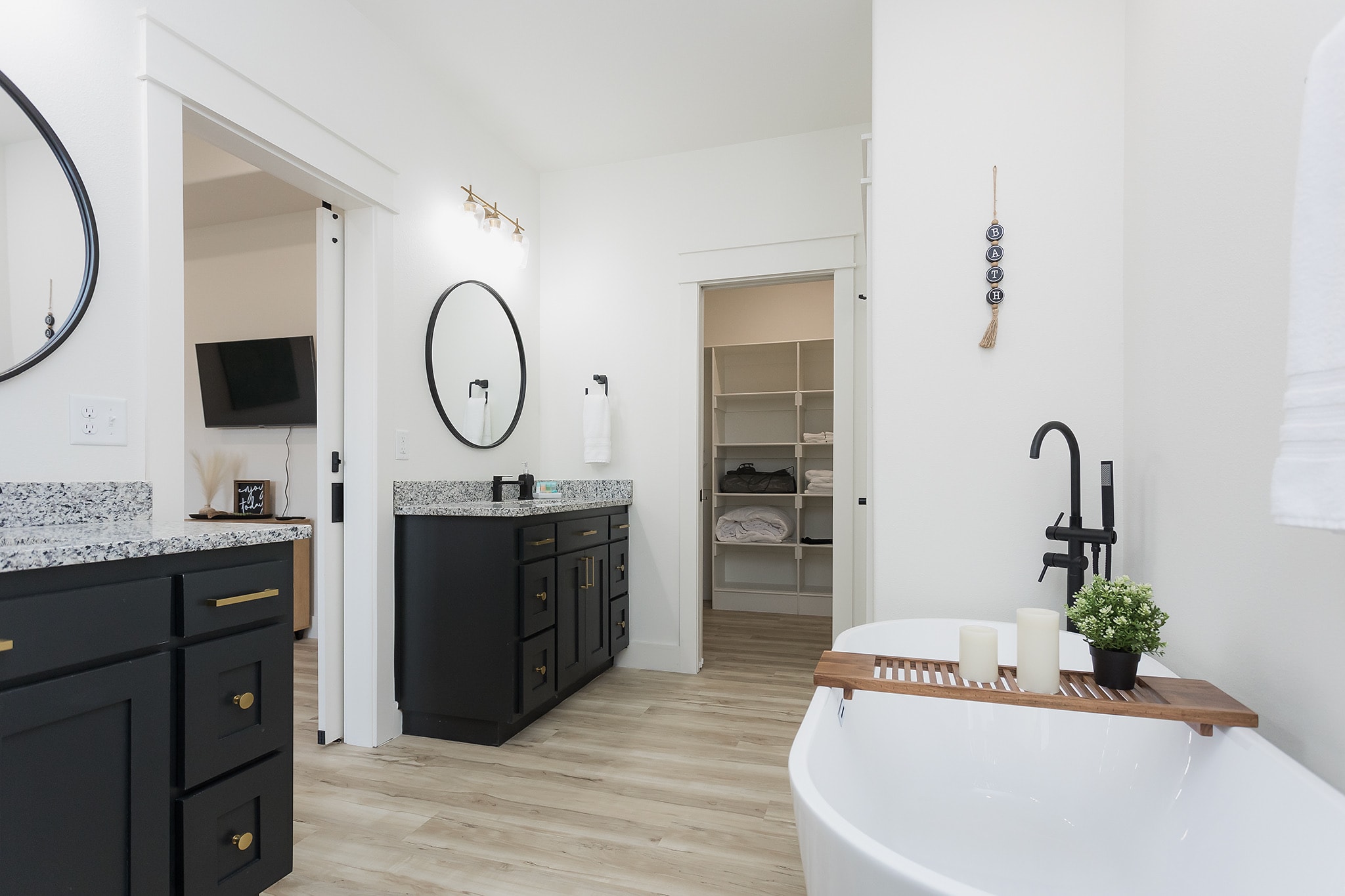 Double vanity and ample storage with walk in closet.