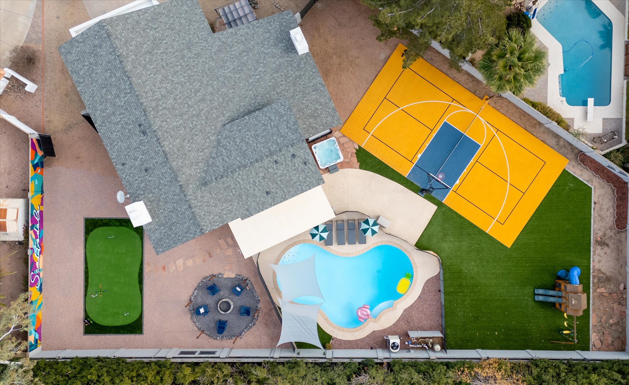 Massive outdoor oasis awaits your stay! Pickleball, basketball, firepit area, heated pool, putt putt, playground, or lounge chairs- Take your pick!