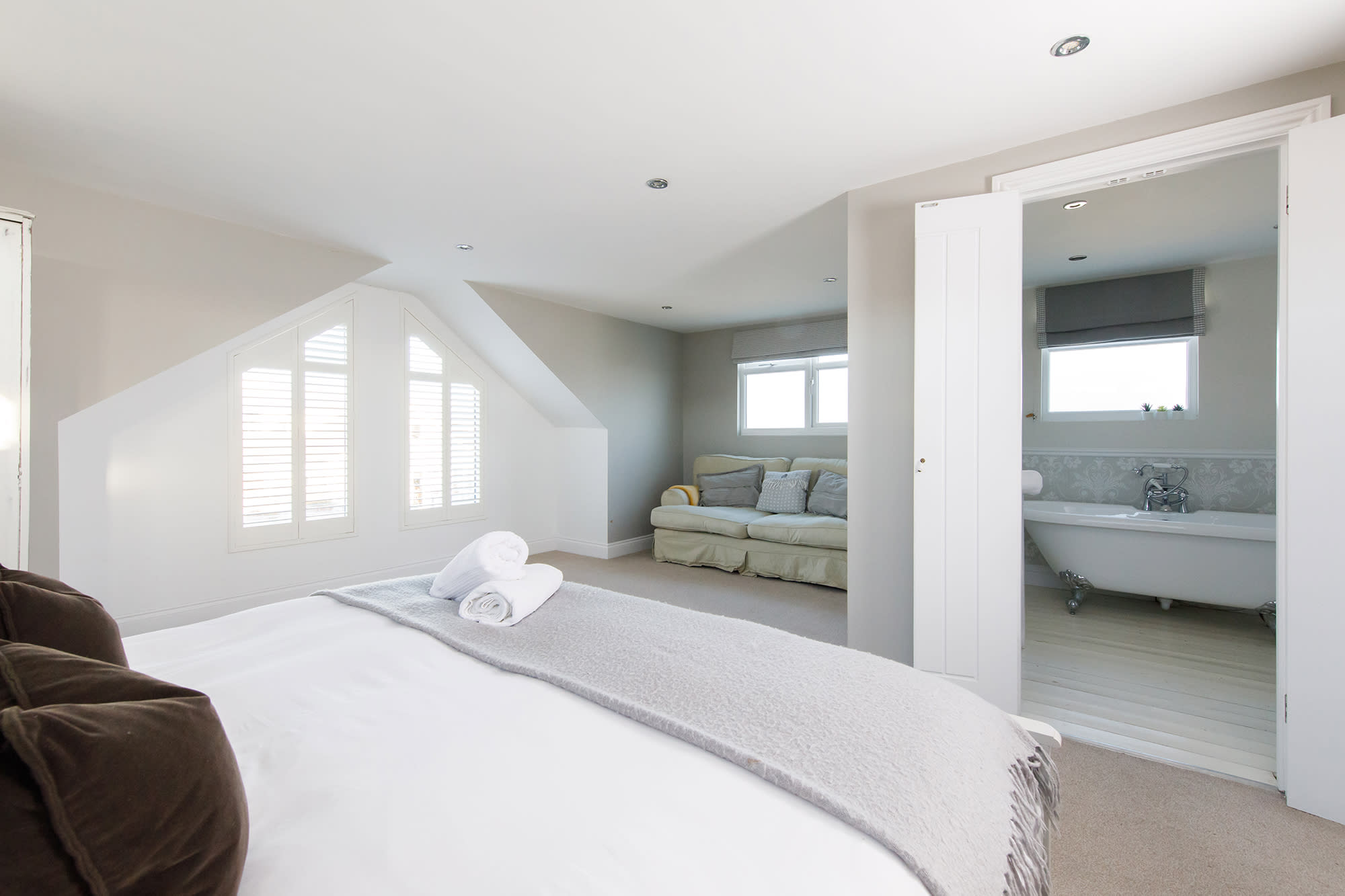 The beautiful master bedroom has a comfy king bed, side tables and reading lights for ultimate comfort.