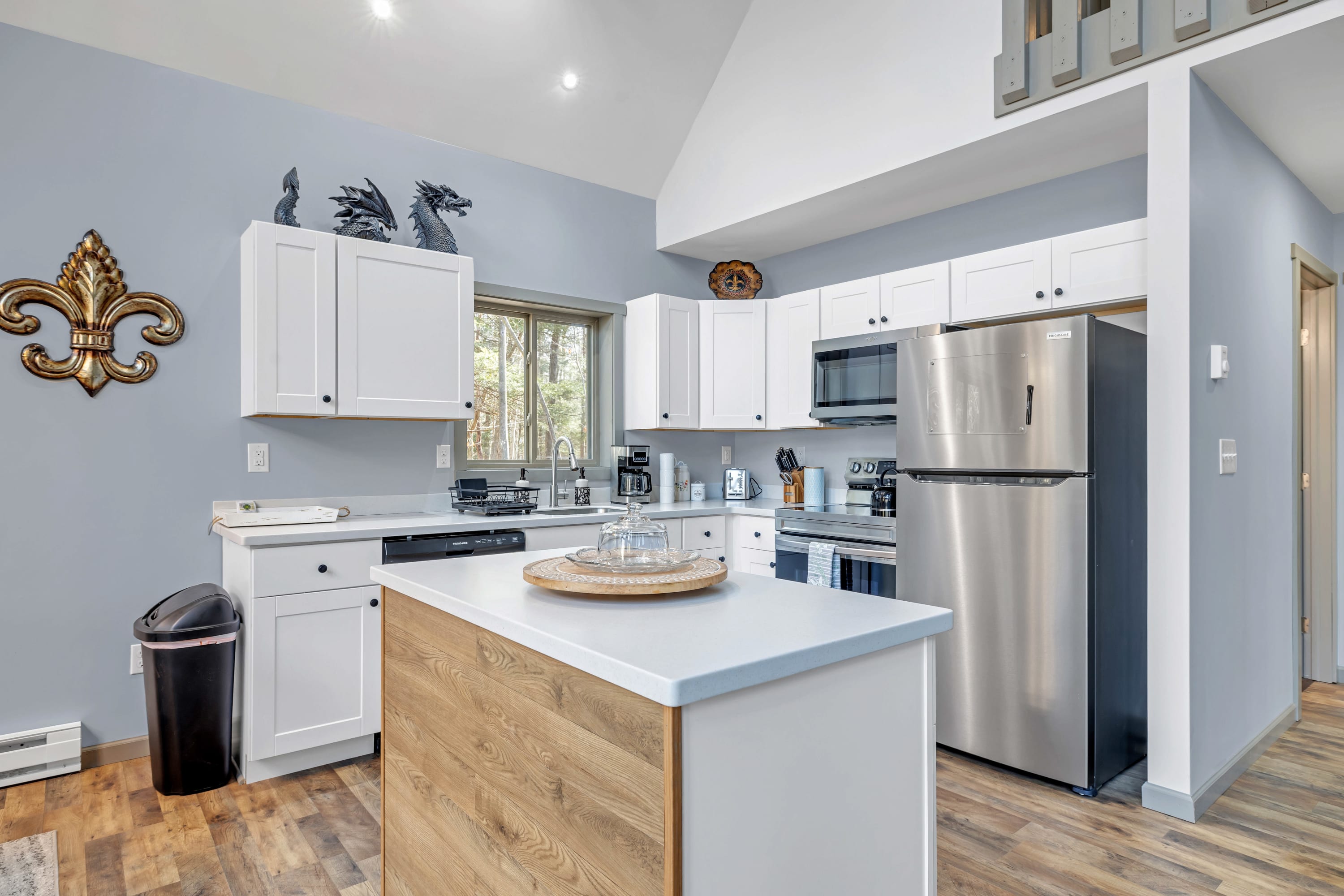 Fully stocked kitchen with an island — ideal for meal prep and casual dining.