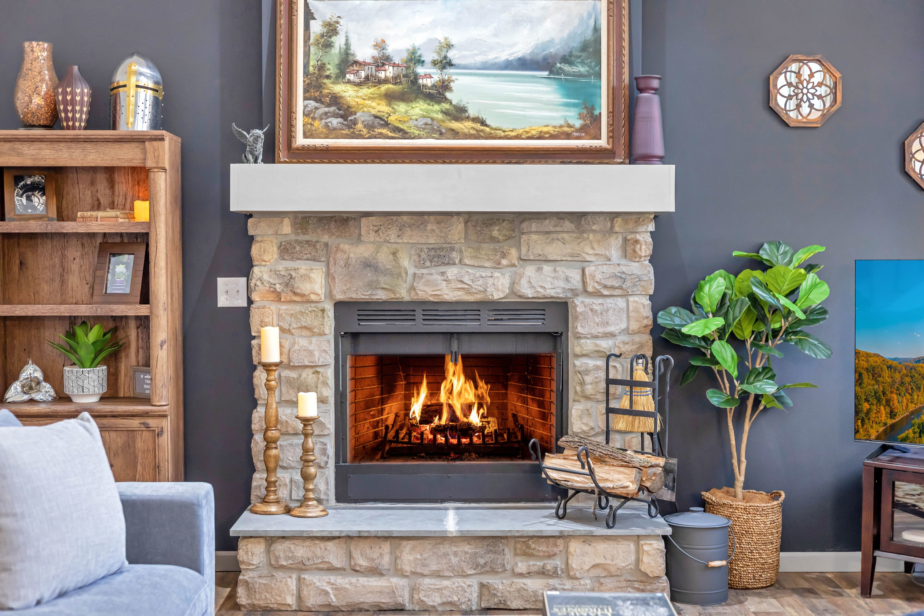 A stunning wood-burning stone fireplace, the perfect focal point for a warm and inviting atmosphere. Enjoy a crackling fire on a cozy evening. 