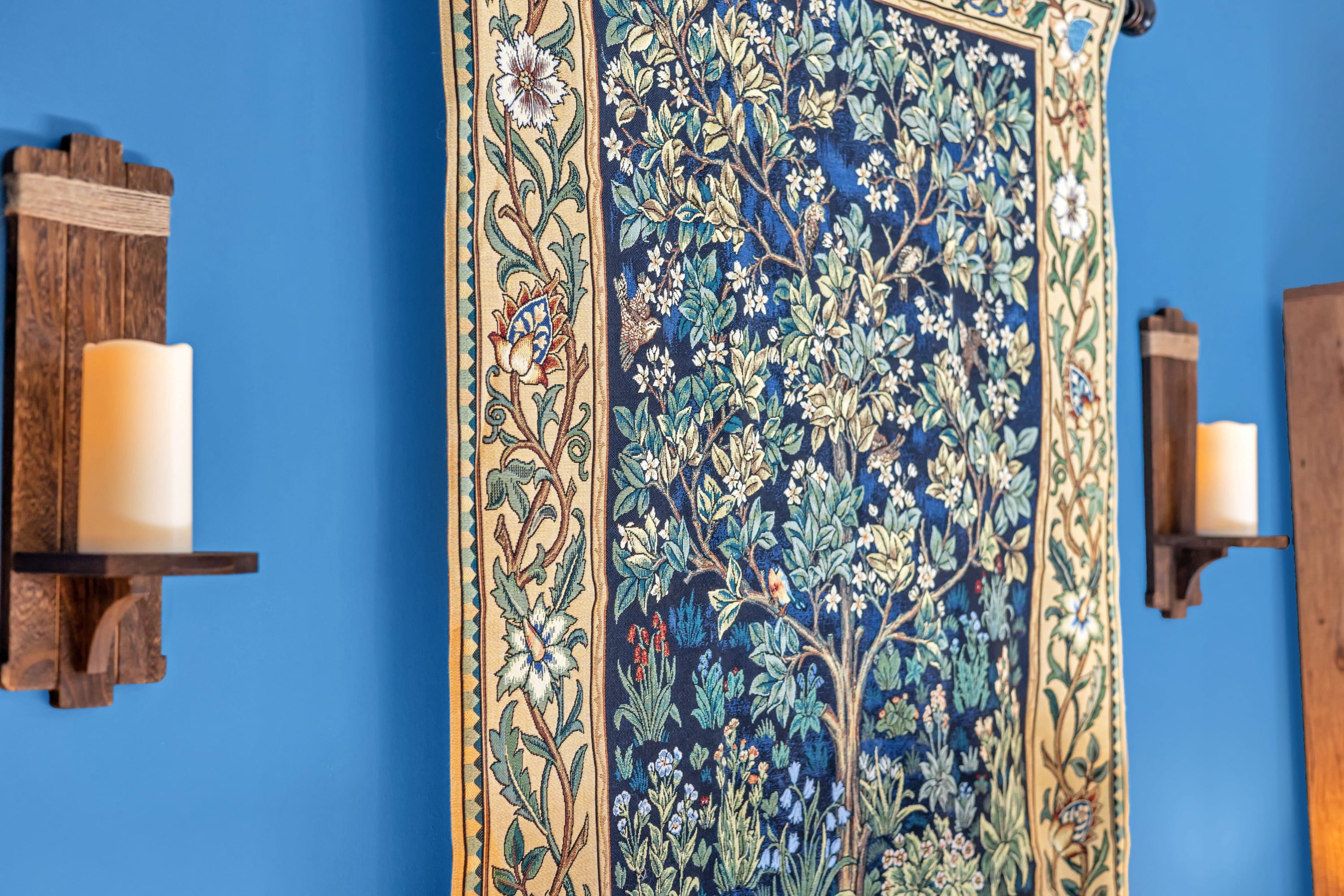 An intricate tapestry showcasing the tree of life, with delicate birds and flowers—adding a unique touch of artistry.