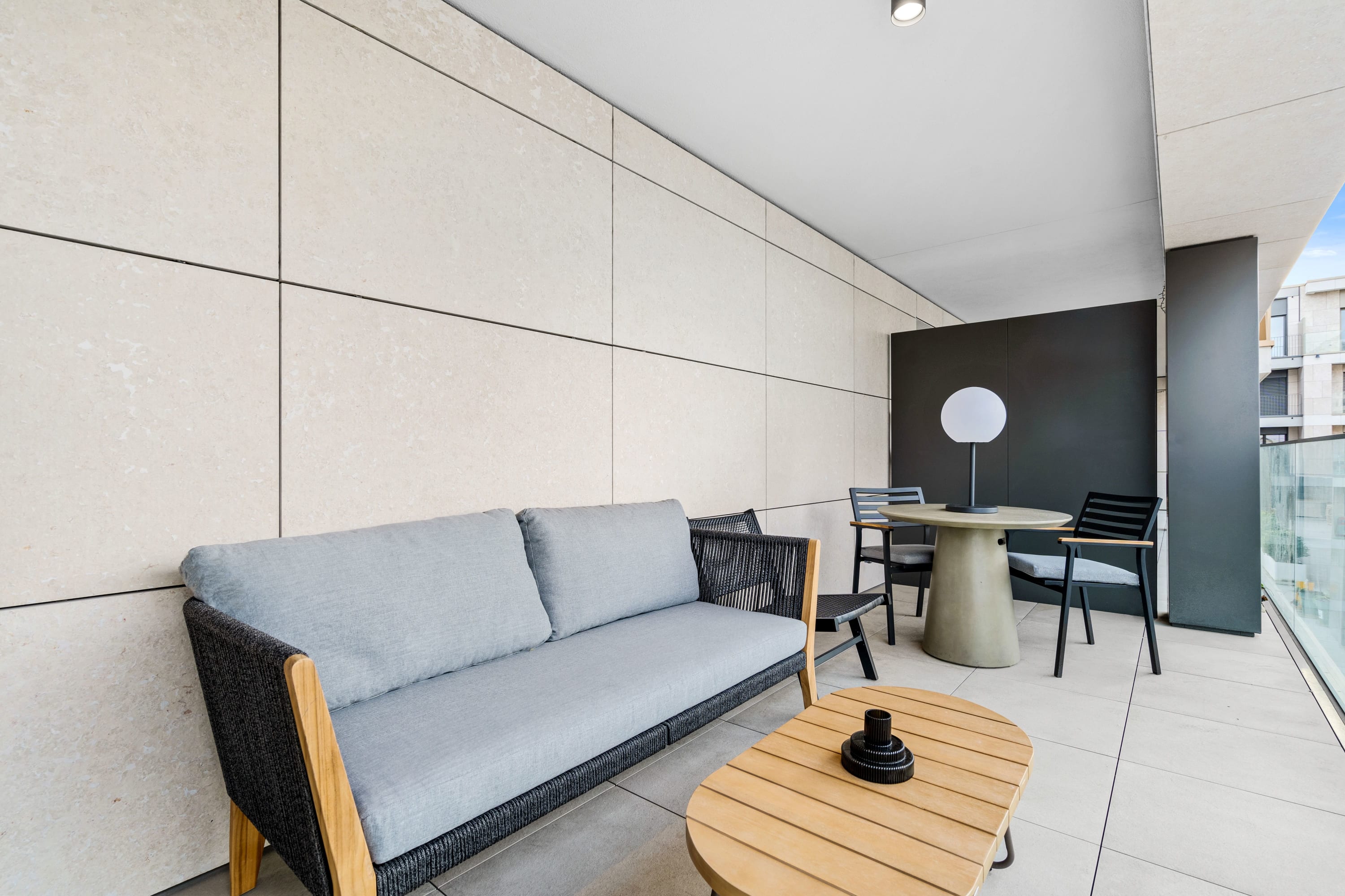 Relax on our cozy balcony lounge, your perfect urban oasis.