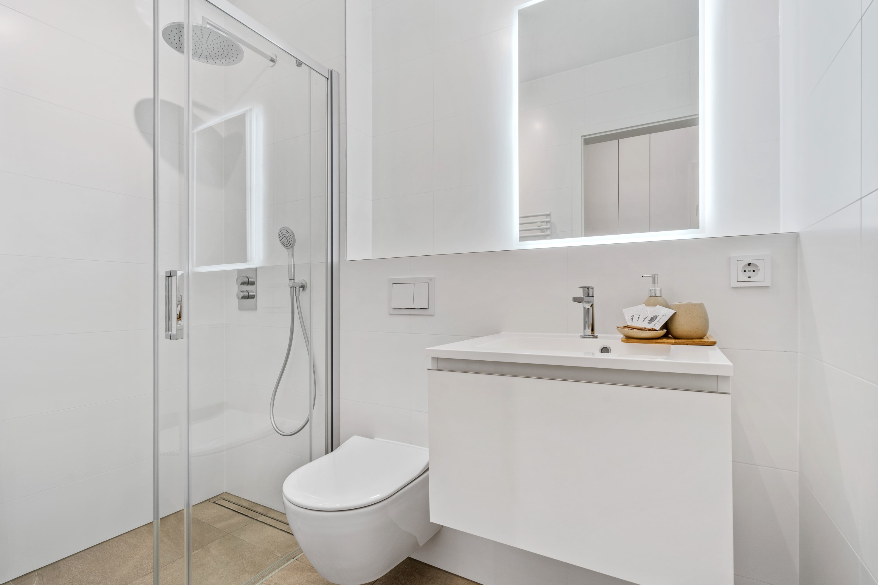Indulge in the simple luxury of our spacious, well-lit bathroom.