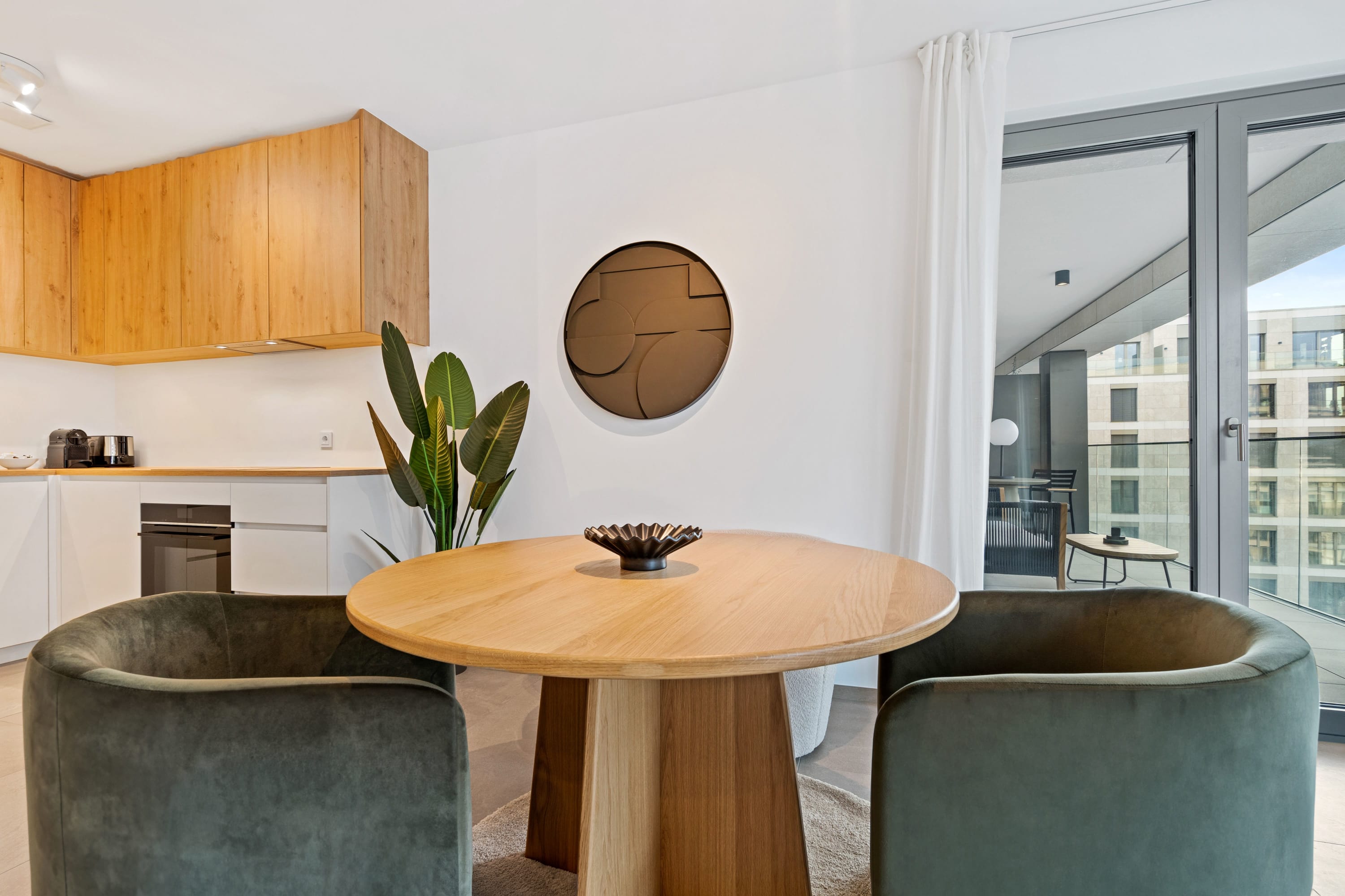Savor a meal or a moment of reflection at our chic, round dining table.