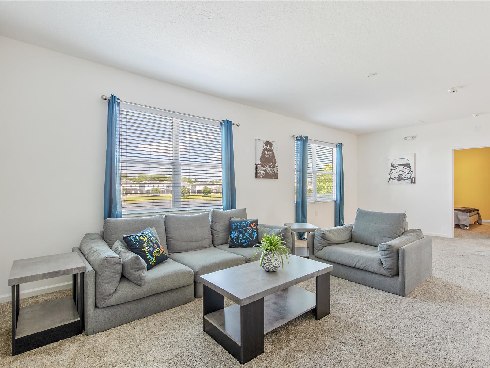 Bright living room w/ comfy seating & TV for laid-back downtime.
