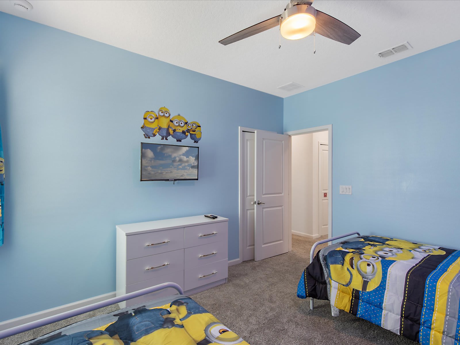 Cheerful bedroom w/ twin beds & colorful accents.