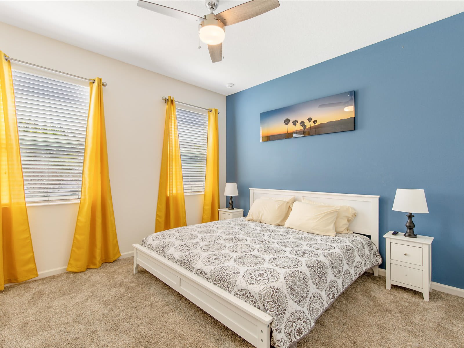 Cheerful bedroom w/ bold accents & a cozy bed for restful nights.