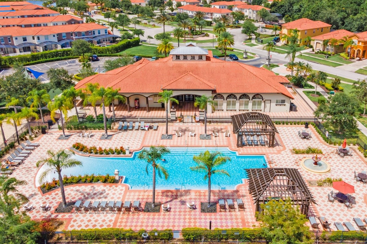 Resort-style pool area w/ loungers, inviting long sunny days.