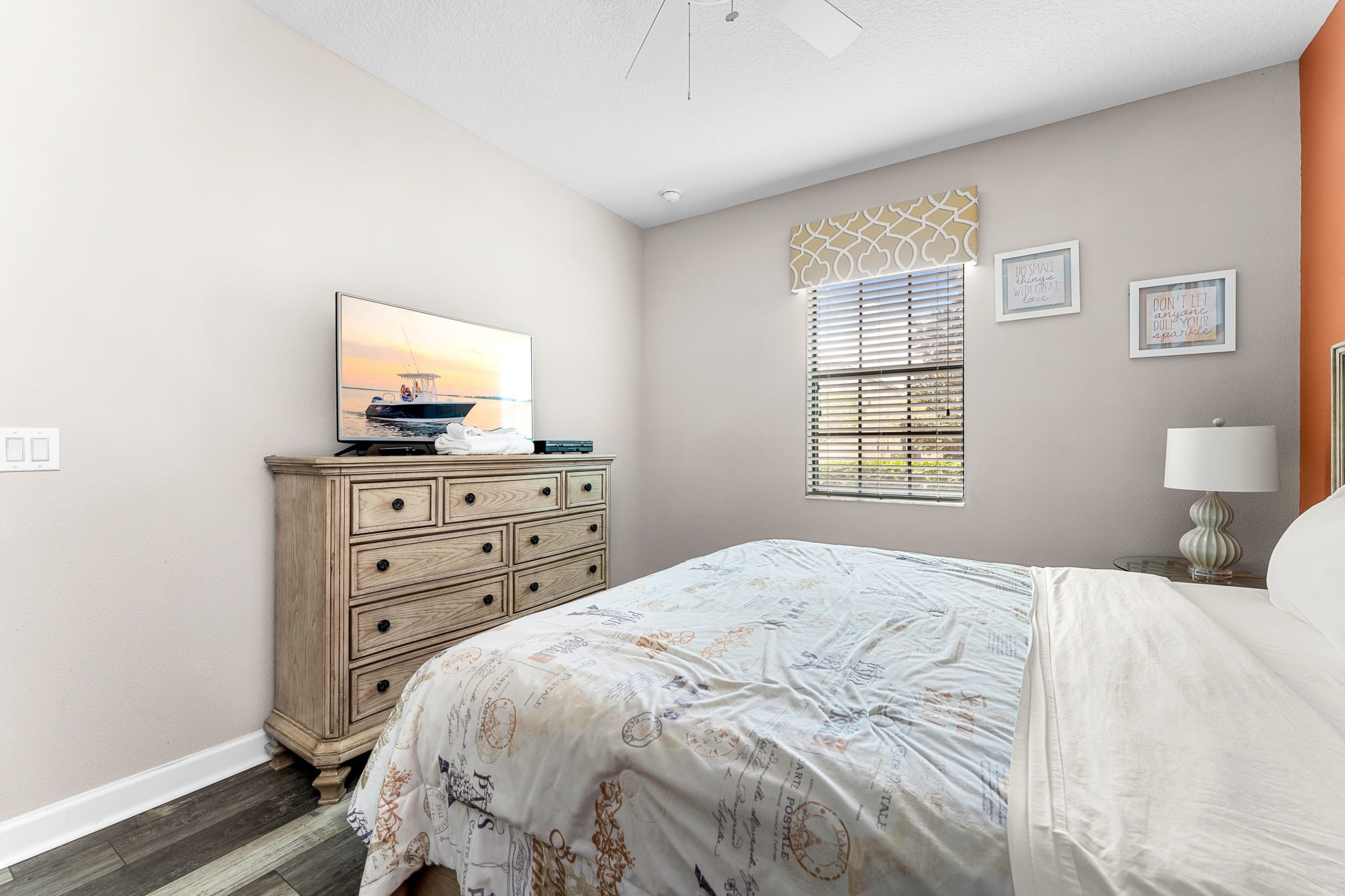 Cozy bedroom w/ soft lighting and neutral tones for a relaxing stay.