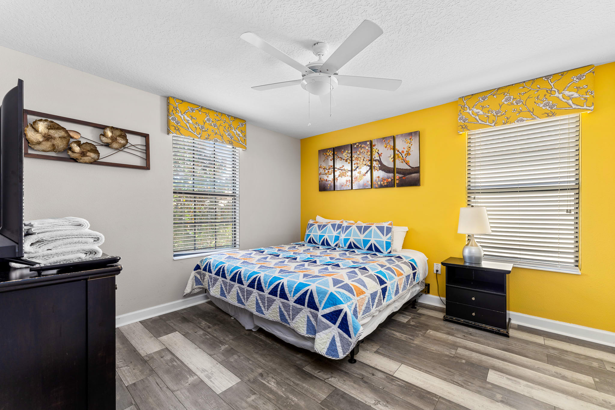Bold yellow-accent bedroom adding energy and personality to the space.