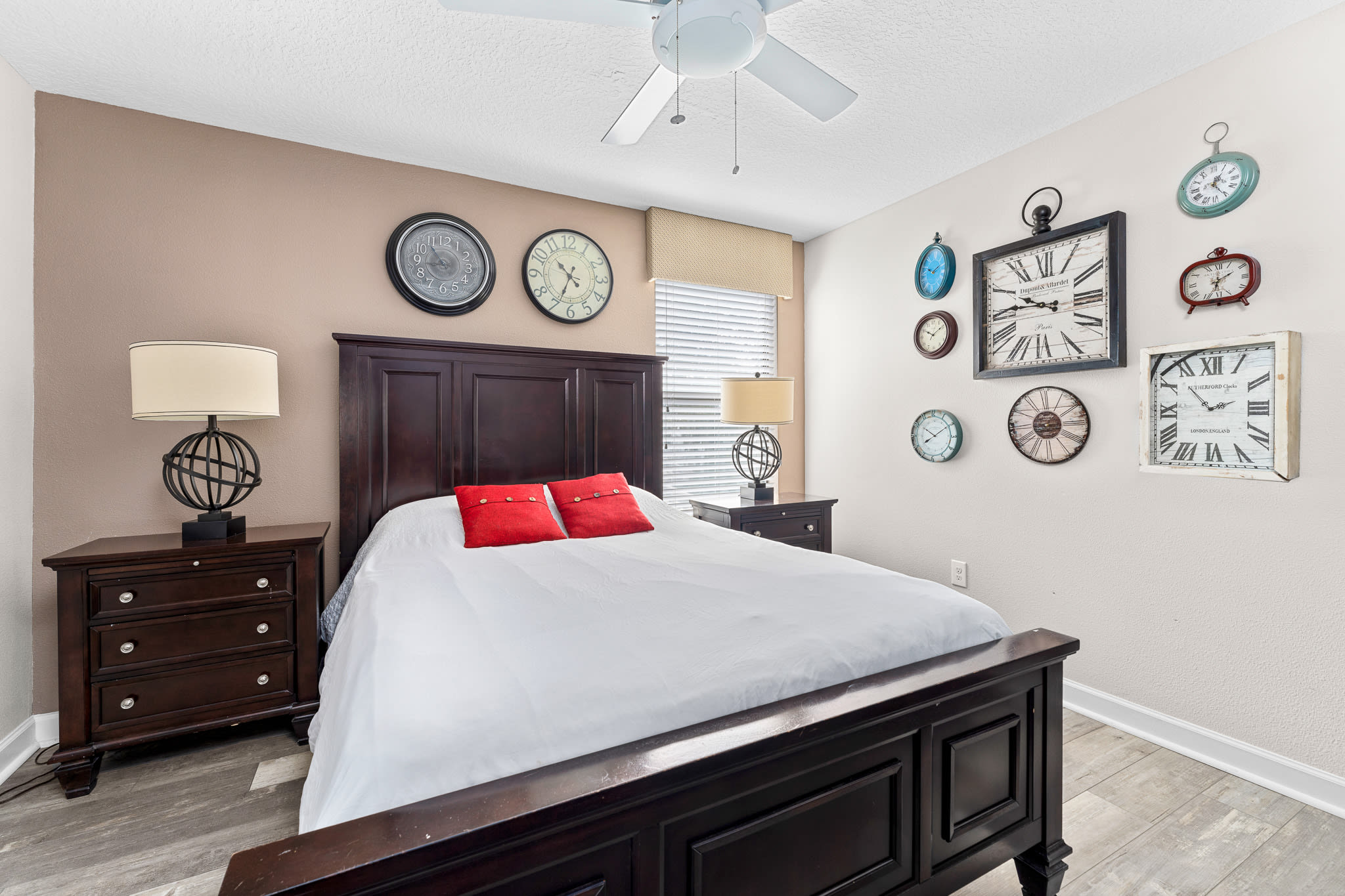 Inviting bedroom w/ contrast bedding and wall art for a cozy night in.