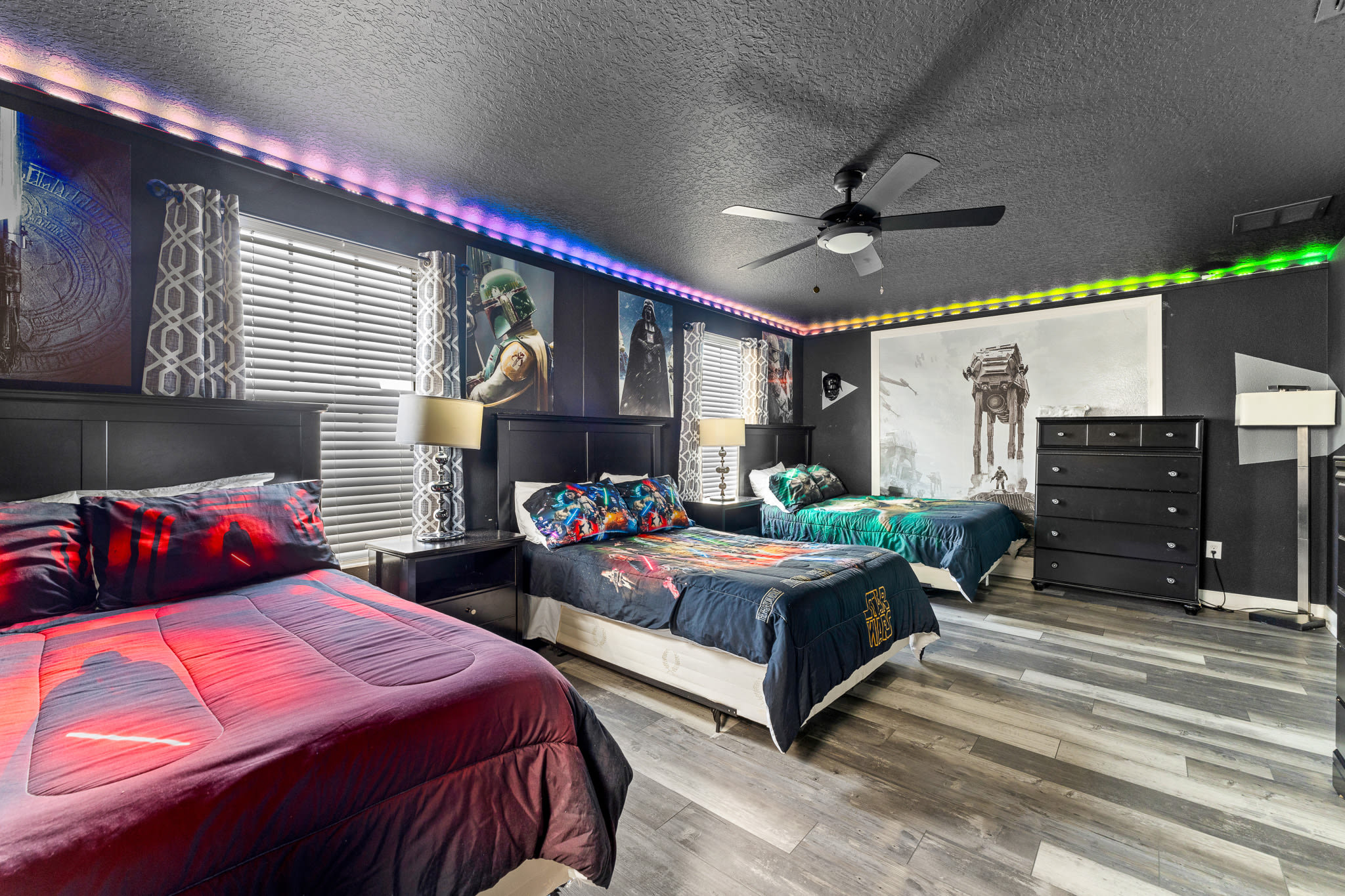 Stylish bedroom w/ bold accents and coordinated lighting details.