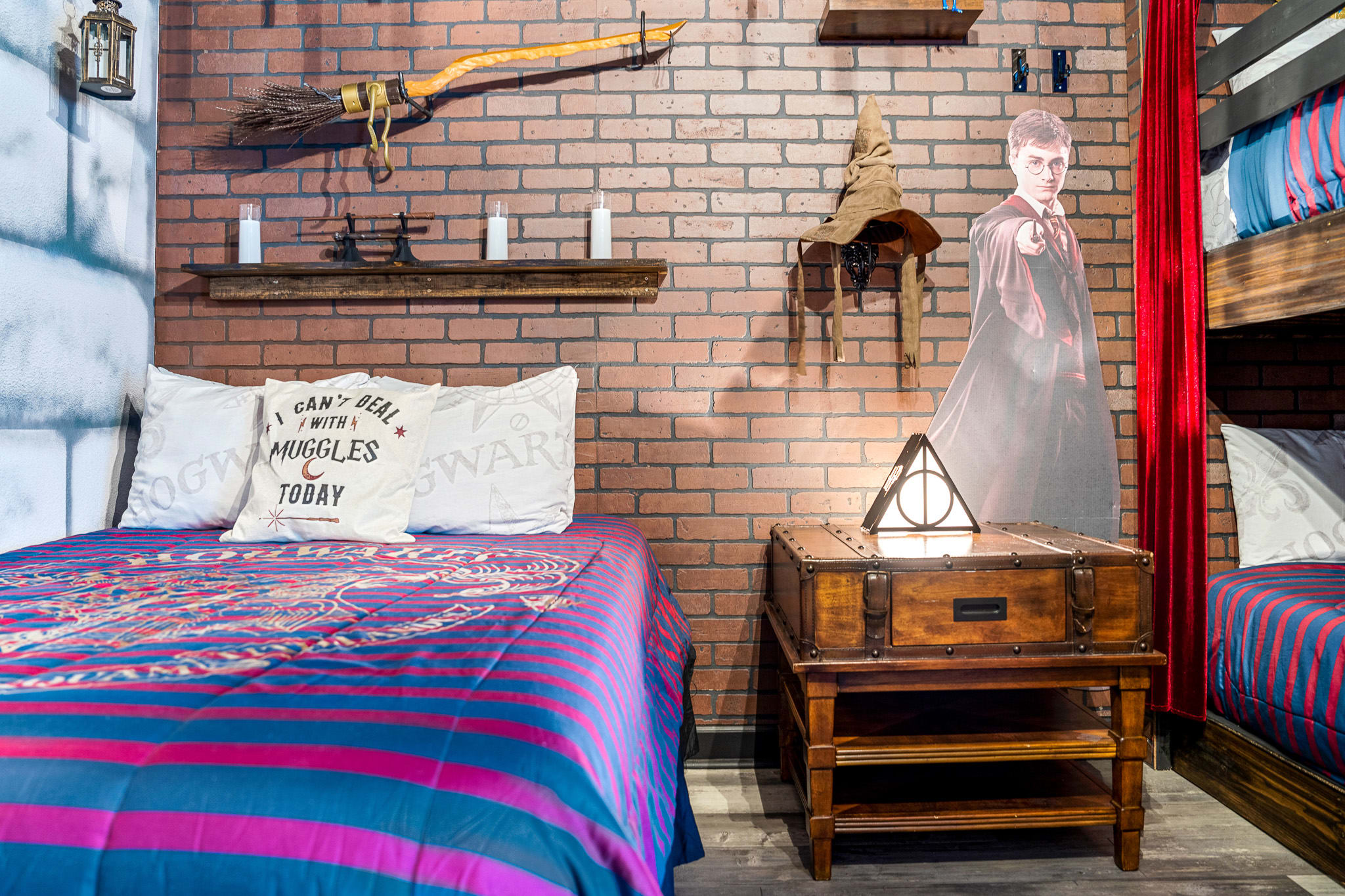 Inviting bedroom w/ wood accents and a ladder-style bunk setup.