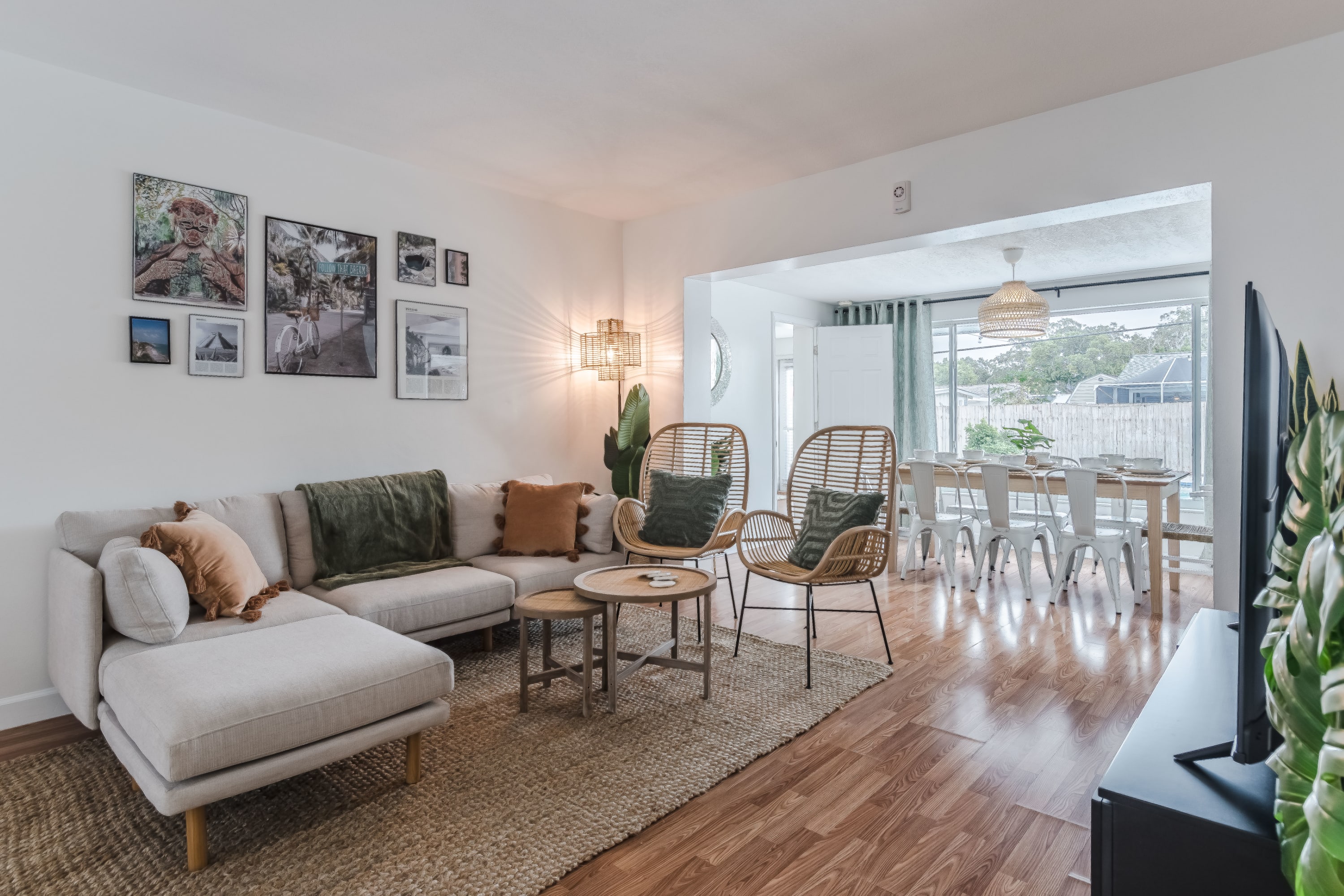 Bright living room w/ comfy seating and natural light throughout