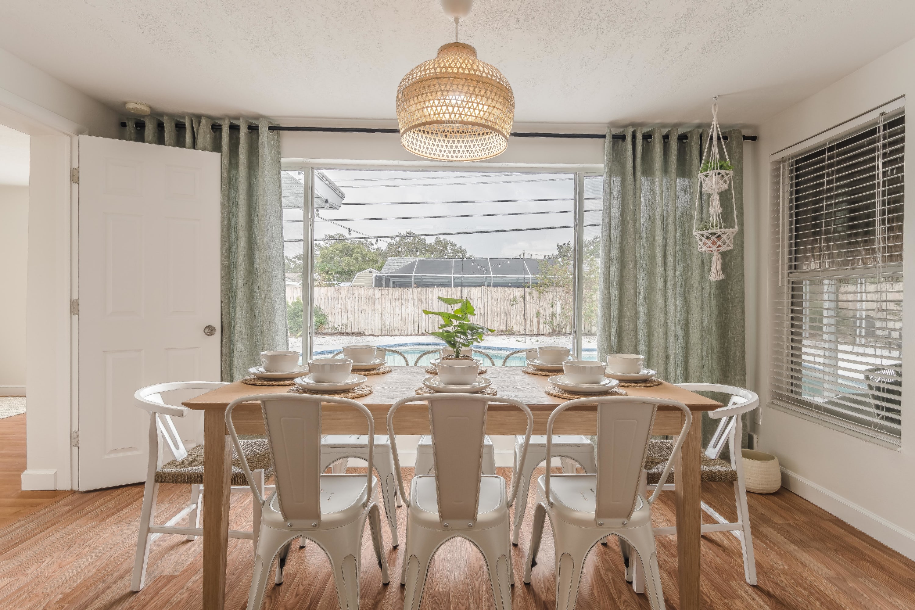 Another view of the dining space w/ soft light and neutral tones