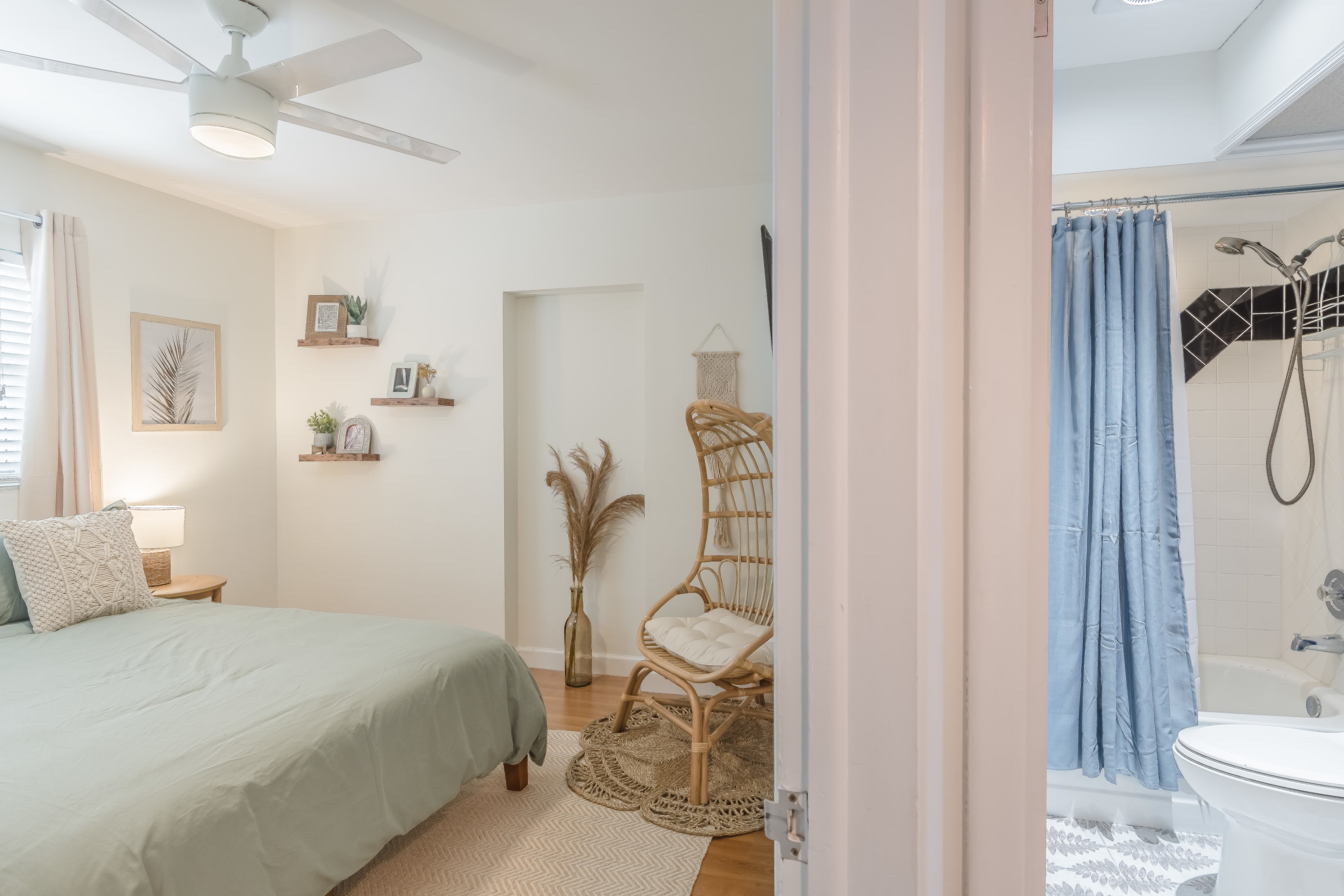 Bedroom angle w/ soft drapes and space to unwind