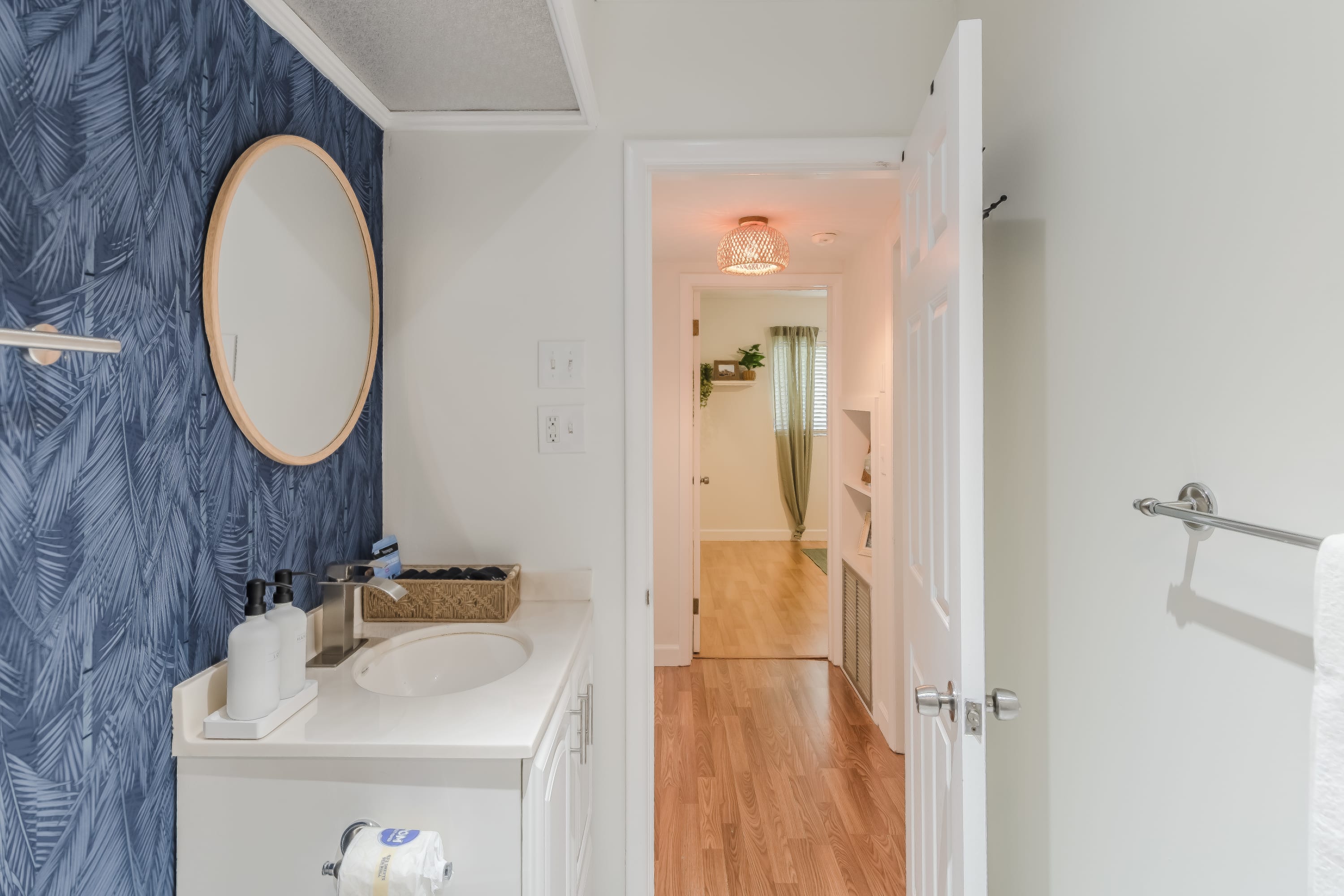 Bathroom view w/ clean finishes and bright natural light