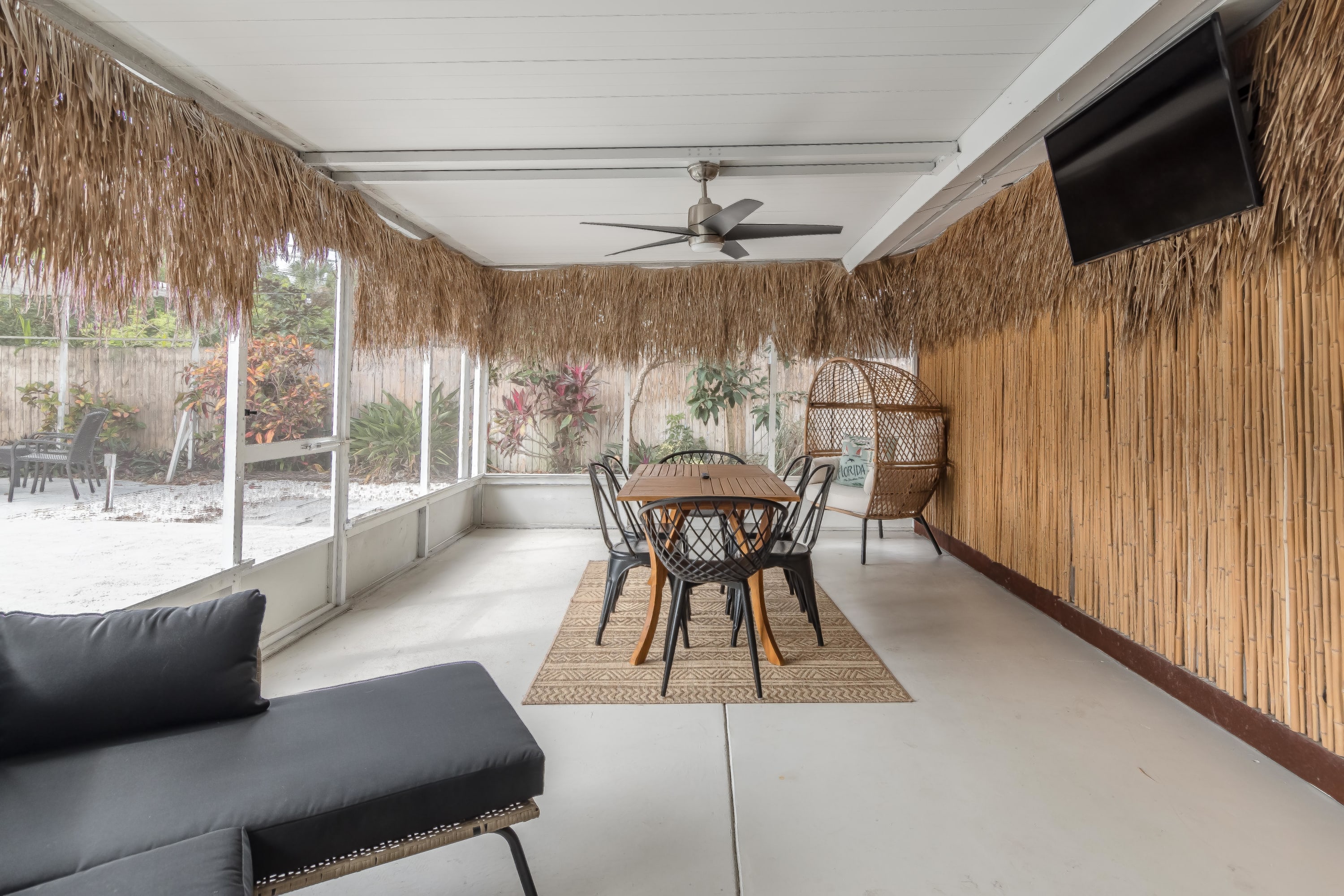 Covered patio w/ cushioned seating for laid-back outdoor lounging