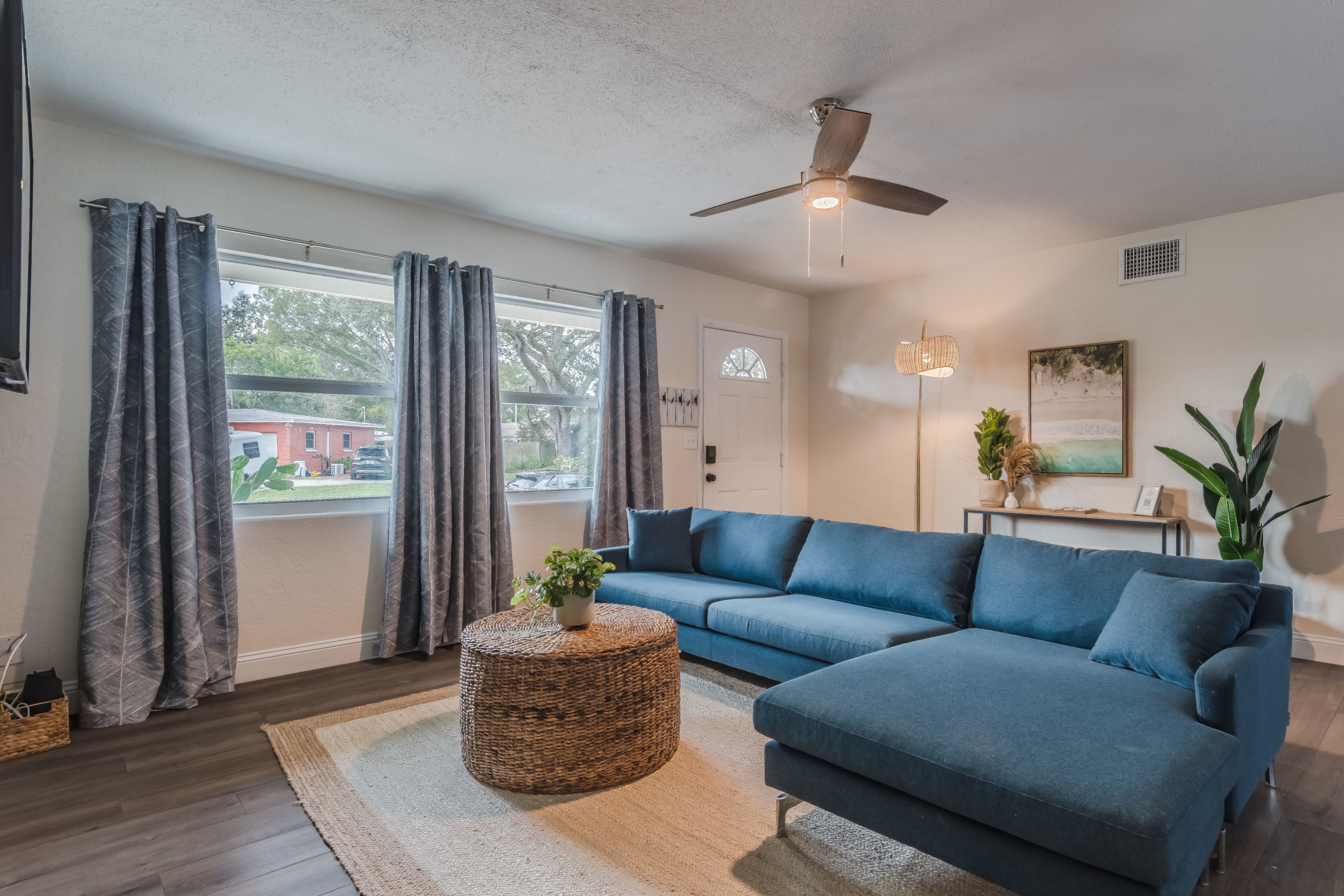 Inviting living room w/ sectional seating and natural light throughout.