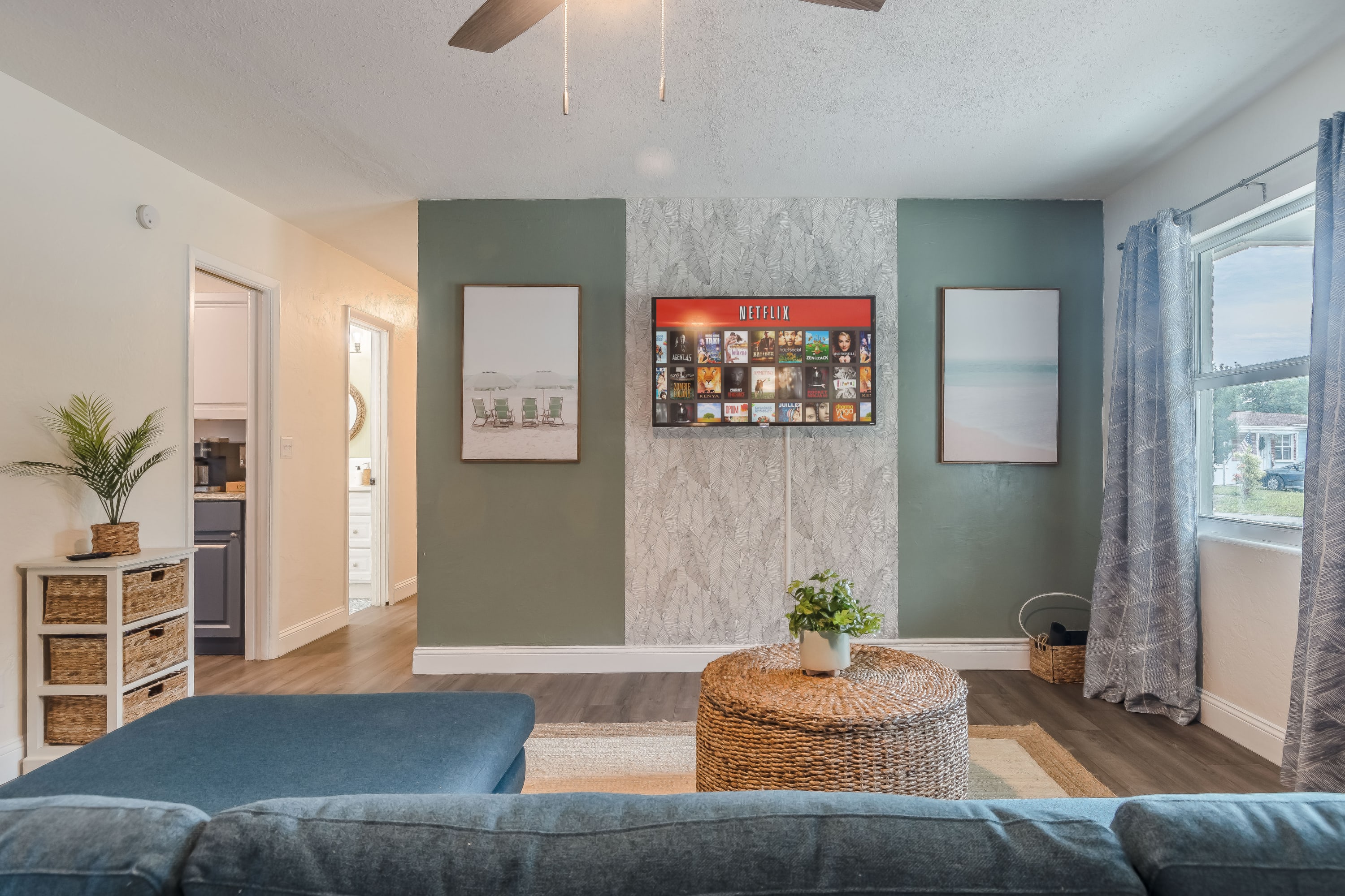 Open living space w/ sofa and TV, designed for laid-back evenings indoors.
